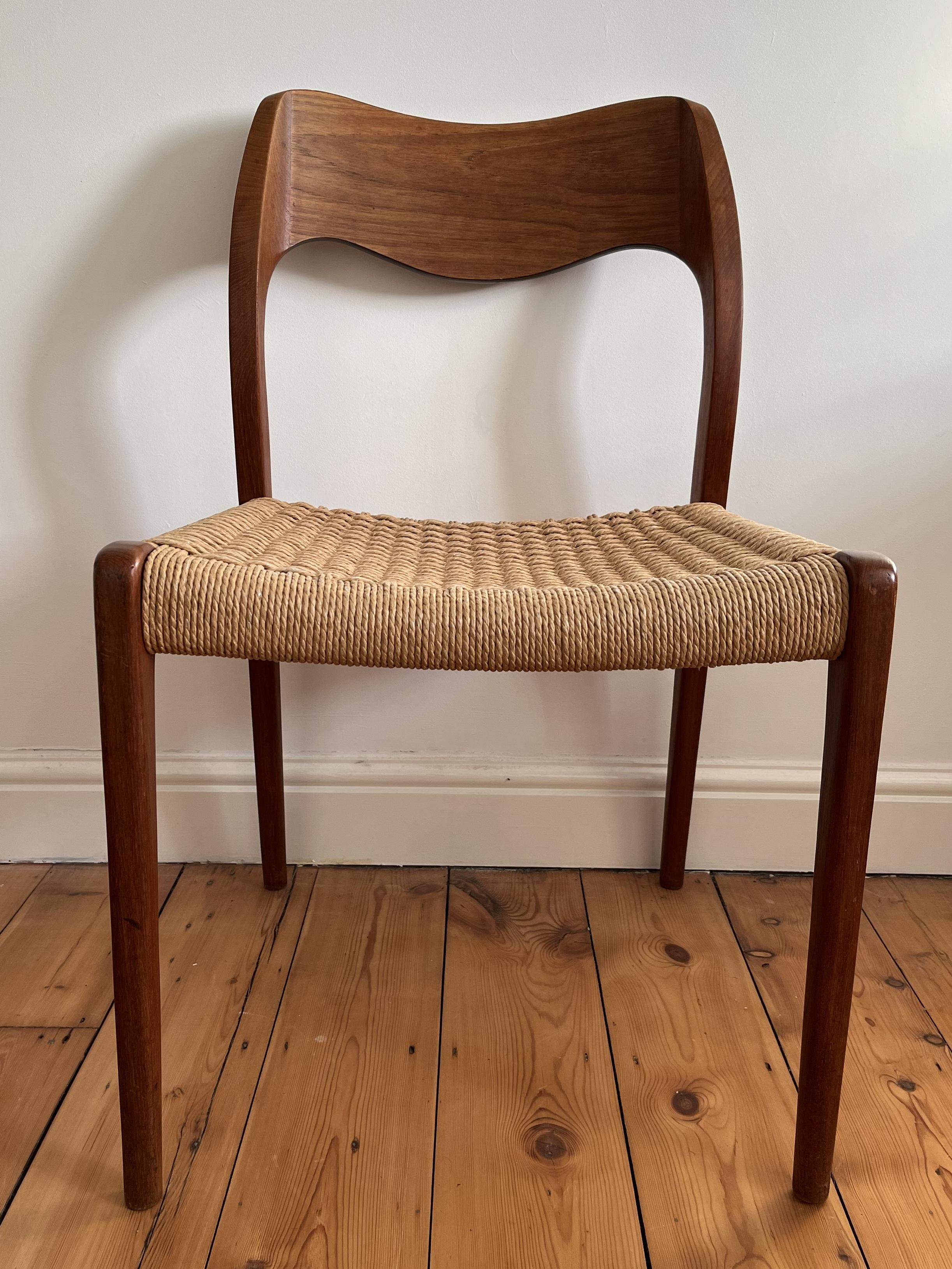 Teak and papercord Niels Moller 71 chair for JL Moller originally designed in 1951.

The chair is in very good original condition. The papercord is all in tact and just shows usual signs of age including some slight opening in places to expose the