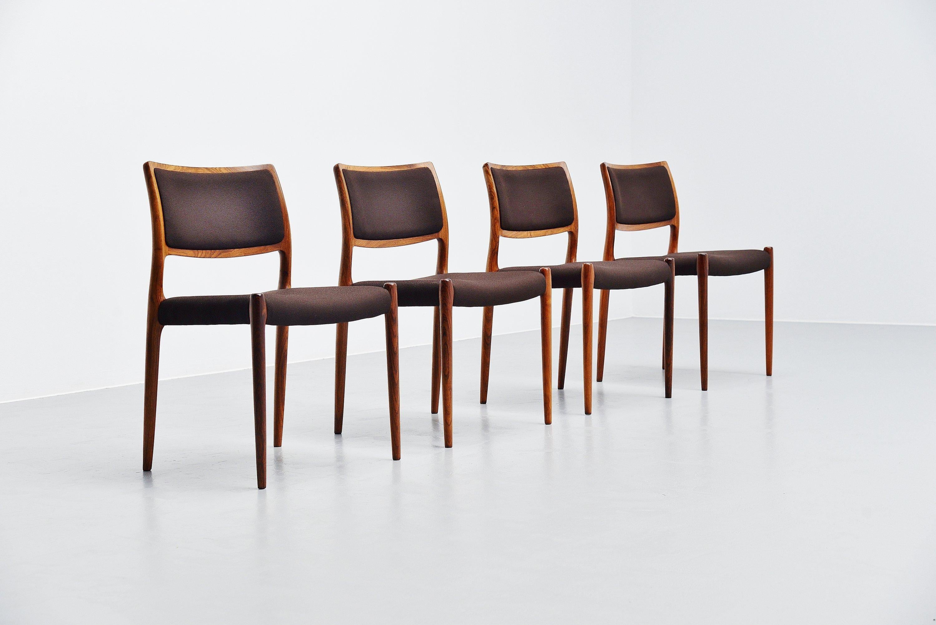 Nice set of 4 dining chairs model 80 designed by Niels Møller and manufactured by J.L Møllers Møbelfabrik, Denmark, 1968. These chairs have a solid rosewood structure which is still in very nice original condition with a nice patina. The chairs are