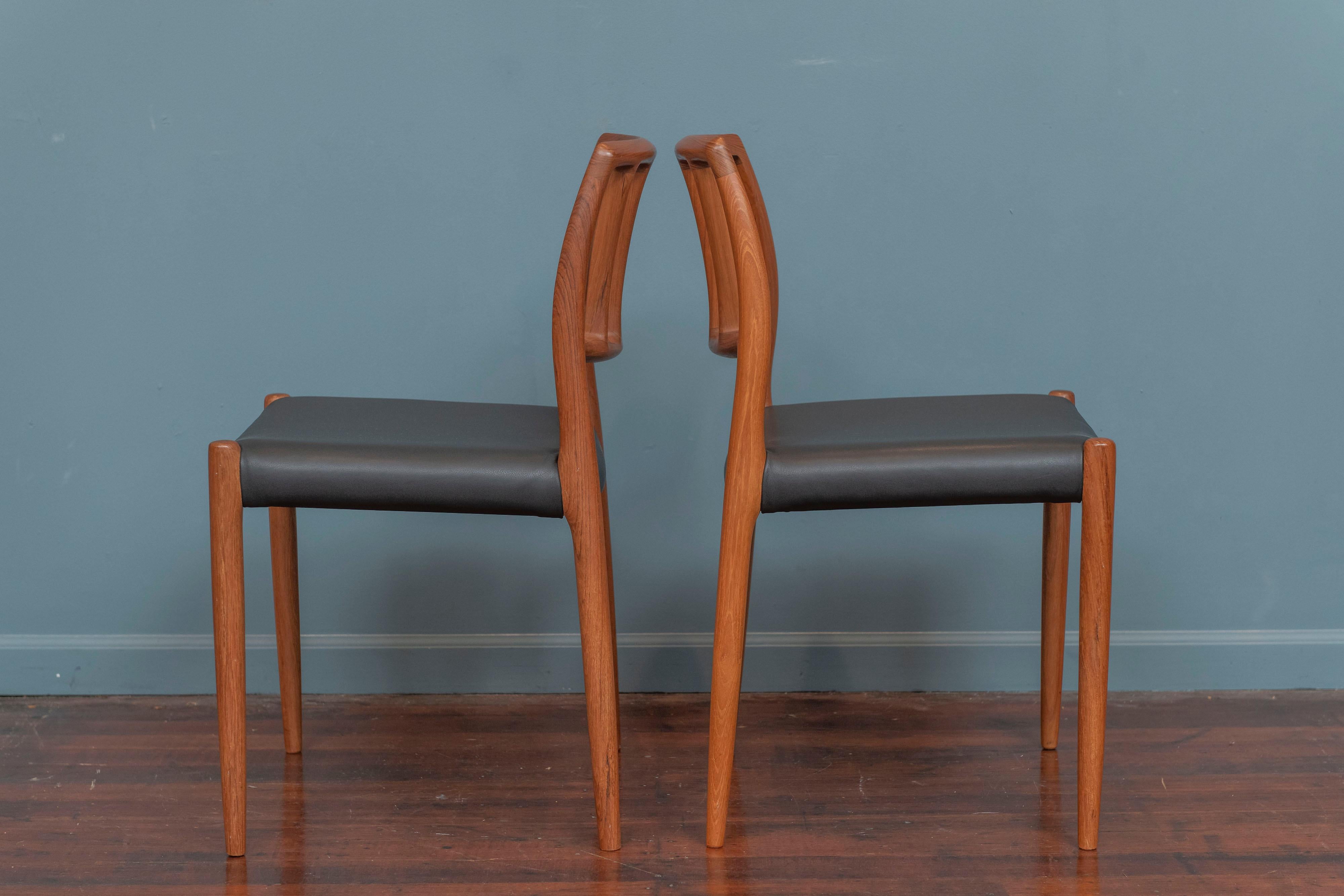 Niels Moller teak Model 83 dining chairs, newly upholstered in black leather. In very good condition with new leather upholstery, stamped.