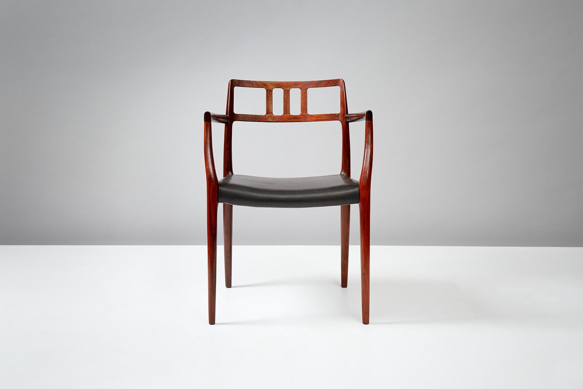 Niels Moller

Rosewood model 64 armchair, designed in 1966 by Niels Moller for his own workshop: J.L. Moller Mobelfabrik in Denmark. The seat has been recovered in new premium quality black aniline leather.
    