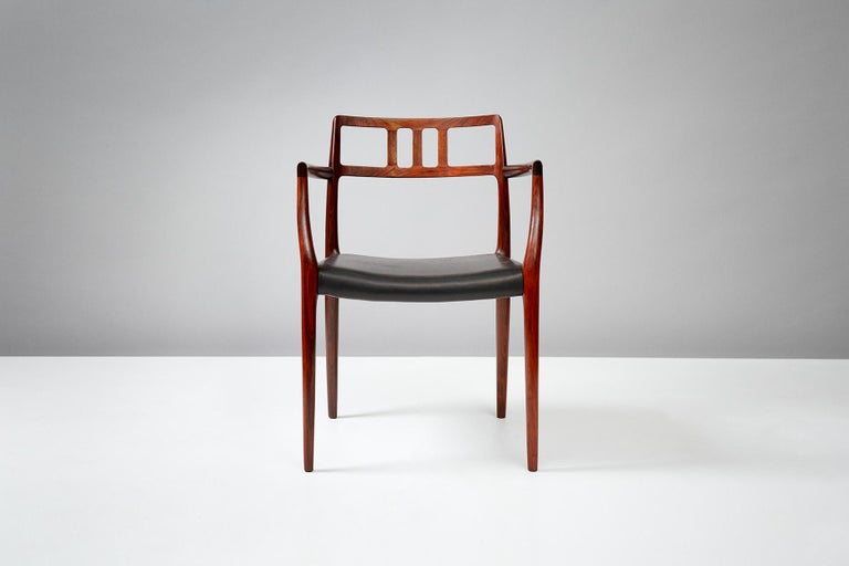 Niels Moller

Rosewood model 64 armchair, designed in 1966 by Niels Moller for his own workshop, J.L. Moller Mobelfabrik in Denmark. The seat has been recovered in new premium quality black aniline leather.
  