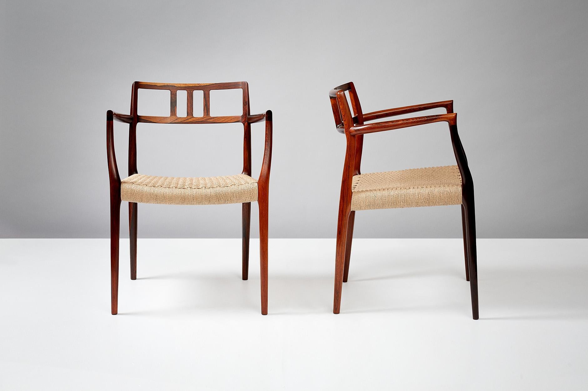 Niels Moller

Rosewood Model 64 armchairs, designed in 1966 by Niels Moller for his own workshop: J.L. Moller Mobelfabrik in Denmark. The seats have been newly woven in Danish papercord.