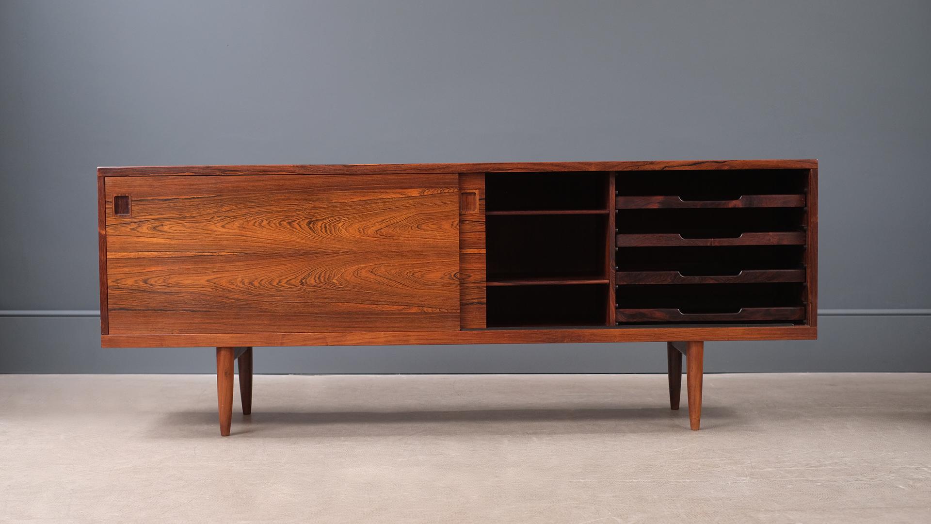Super sought after and rare 1960s sideboard in wonderful rosewood with a staggering grain designed by Niels Moller, Denmark. Elegant proportions, simple detailing and ultra high quality piece.
