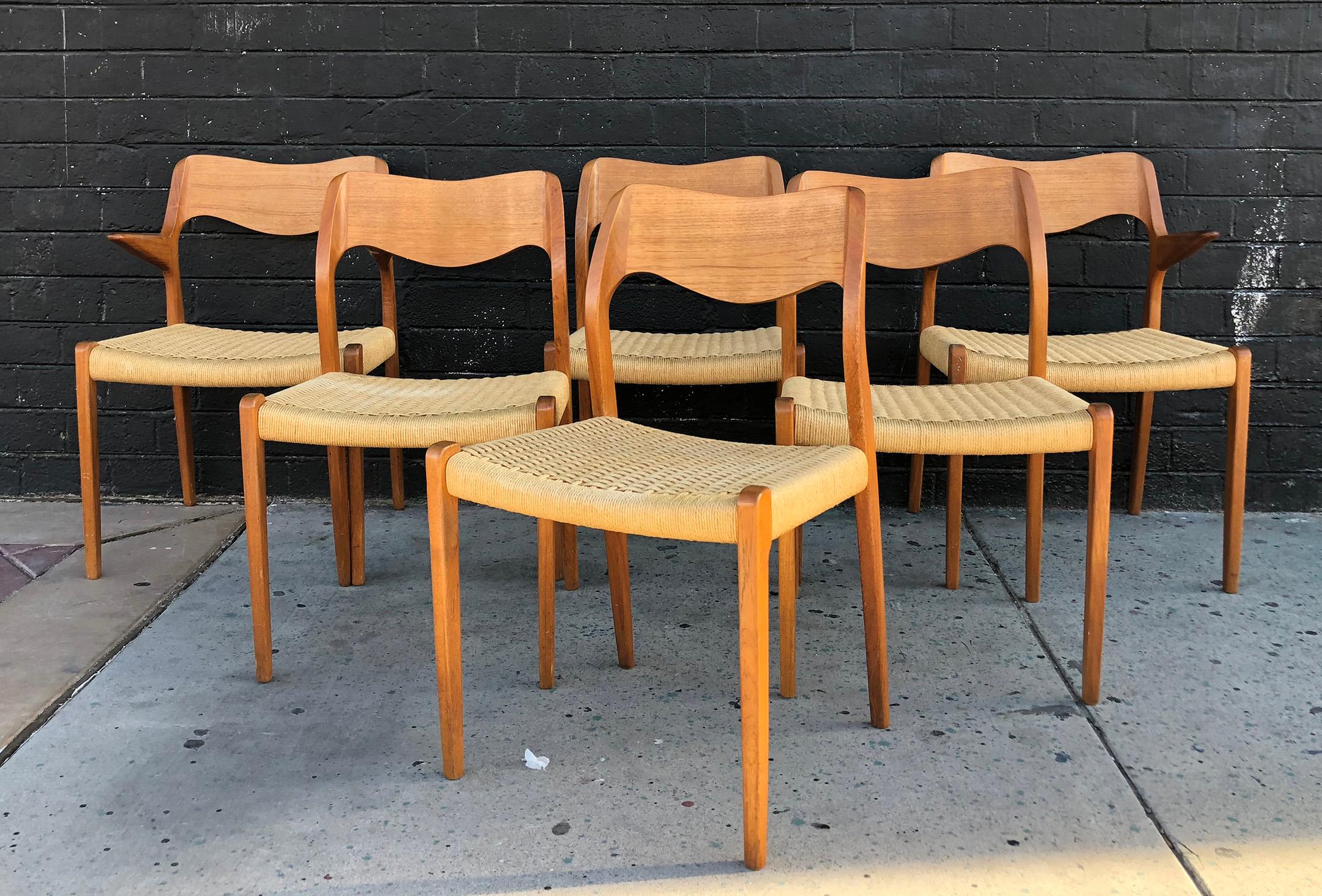 Available right now we have a striking set of six dining chairs model 71 designed by Niels O. Møller. By J.L Møllers Møbelfabrik in Denmark. Two Captains / armchairs and four side chairs.