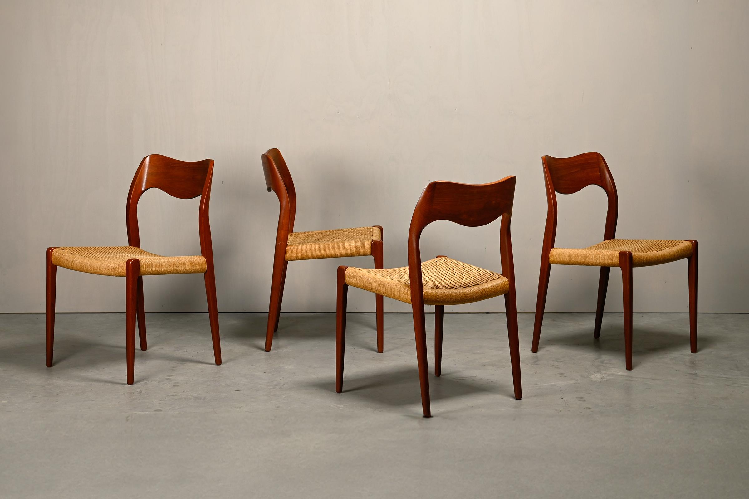 Beautiful set of vintage Niels O. Møller Model 71 dining chairs, produced by J. L. Møllers in Denmark. Teak frames with Papercord seats, all in good original condition with normal signs of use. The chair with sleek but elegant proportions has a
