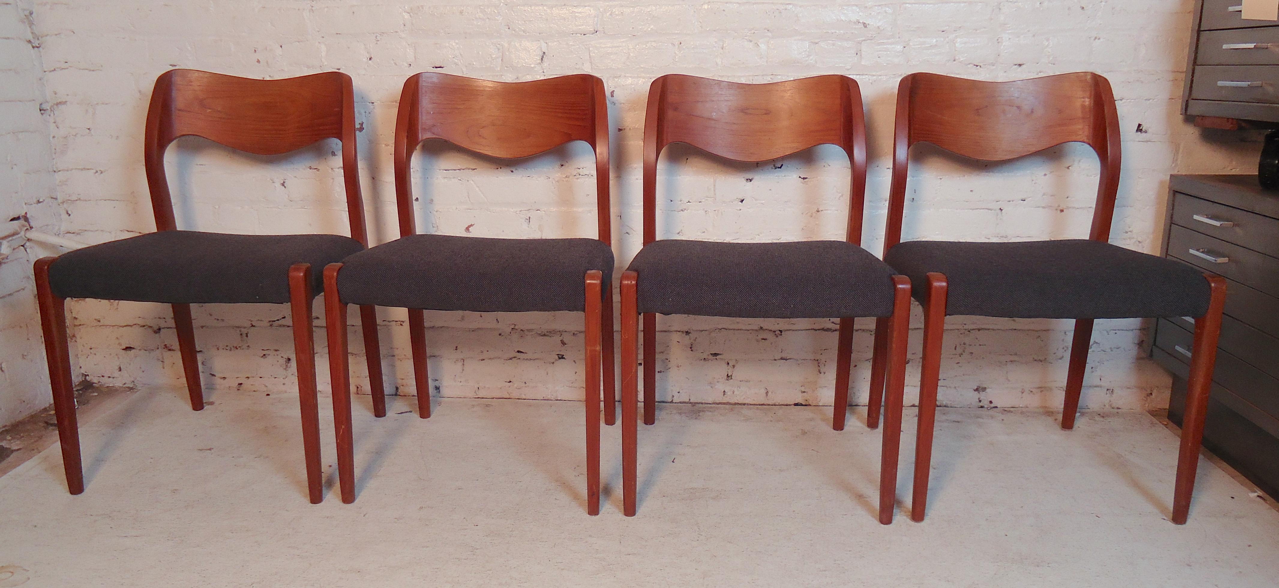 Classic Danish modern chairs designed by Niels O. Møller. With curving backs and tapered legs, all in teak wood.
(Please confirm item location - NY or NJ - with dealer).
  