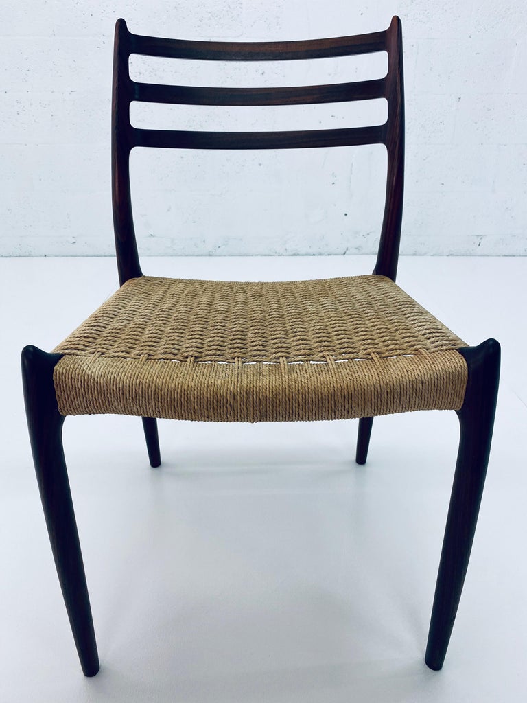 Niels Otto Møller No. 78 rosewood dining or desk chair with woven papercord seat for J.L. Møller Møbelfabrik.