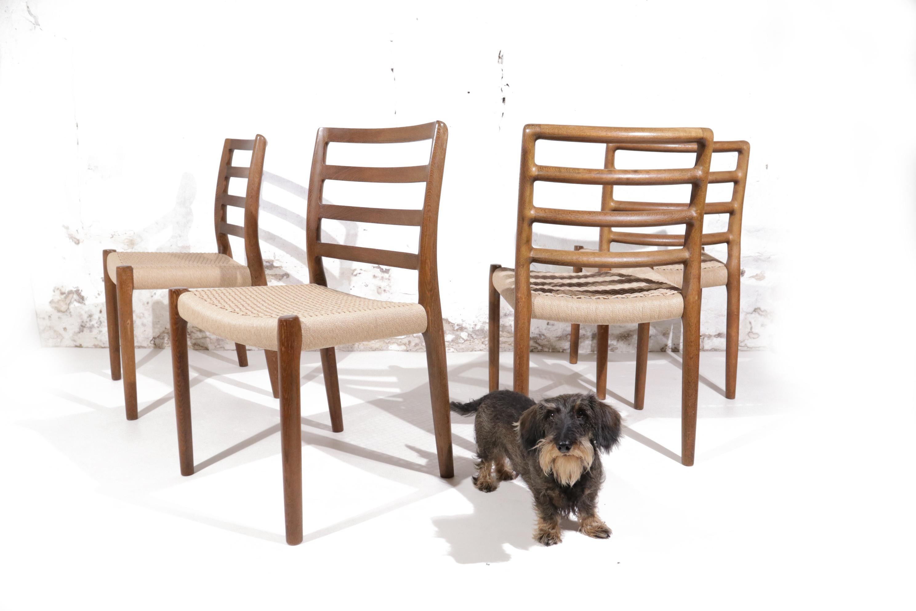A set of 4 model 85 dining chairs designed by Niels Otto Moller for J.L. Møllers in the 1960's
Oak frame and renewed Papercord seating.
In very nice condition.

Keywords; Elegance, Durable, Pure, Natural materials, Art, Sculptural, Classical,
