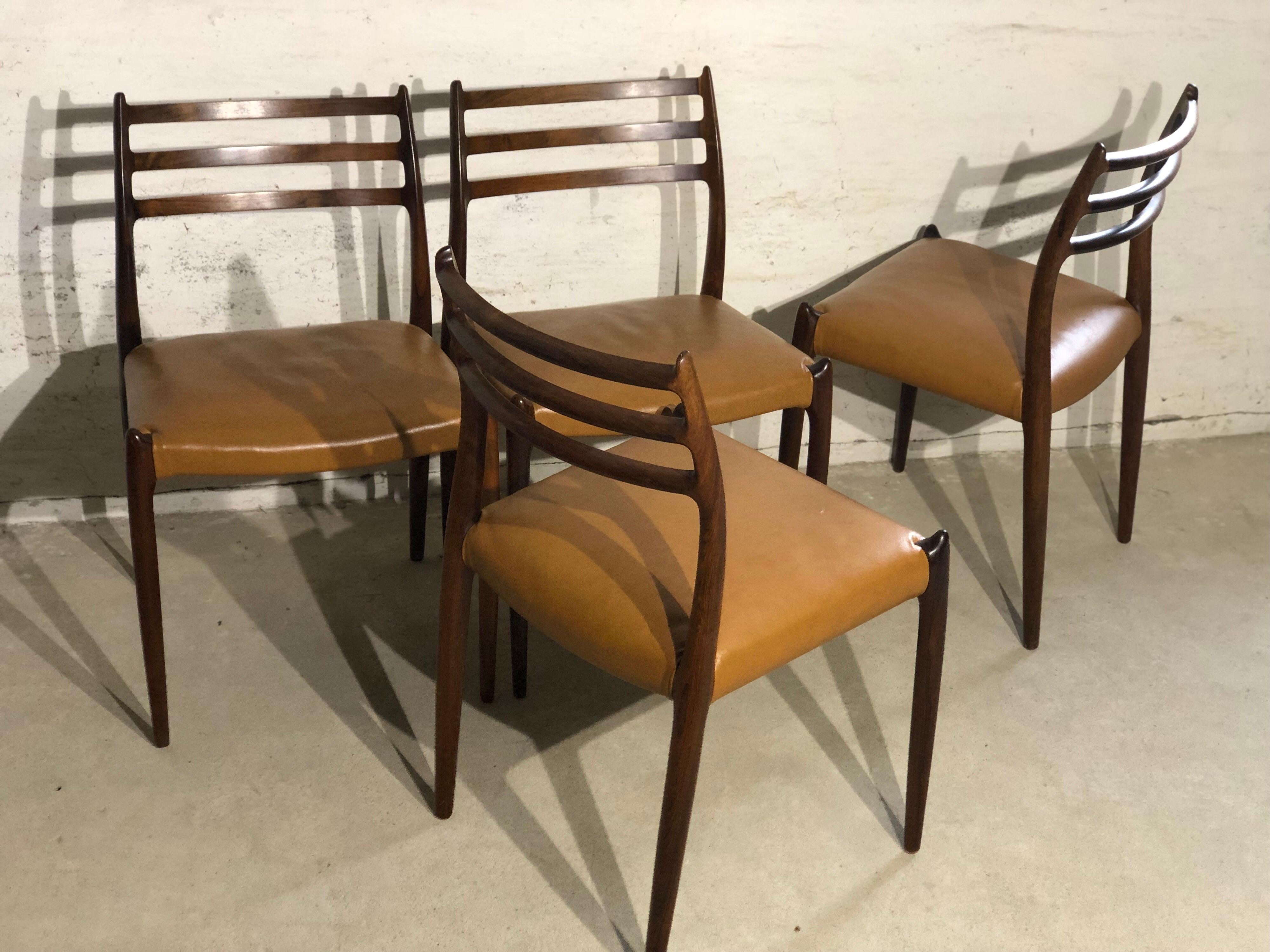 Niels O. Møller No. 78, Set of 4 rosewood dining chairs. The wooden frame has stunning details, upholstery in light brown leather. They are in a very good vintage condition.