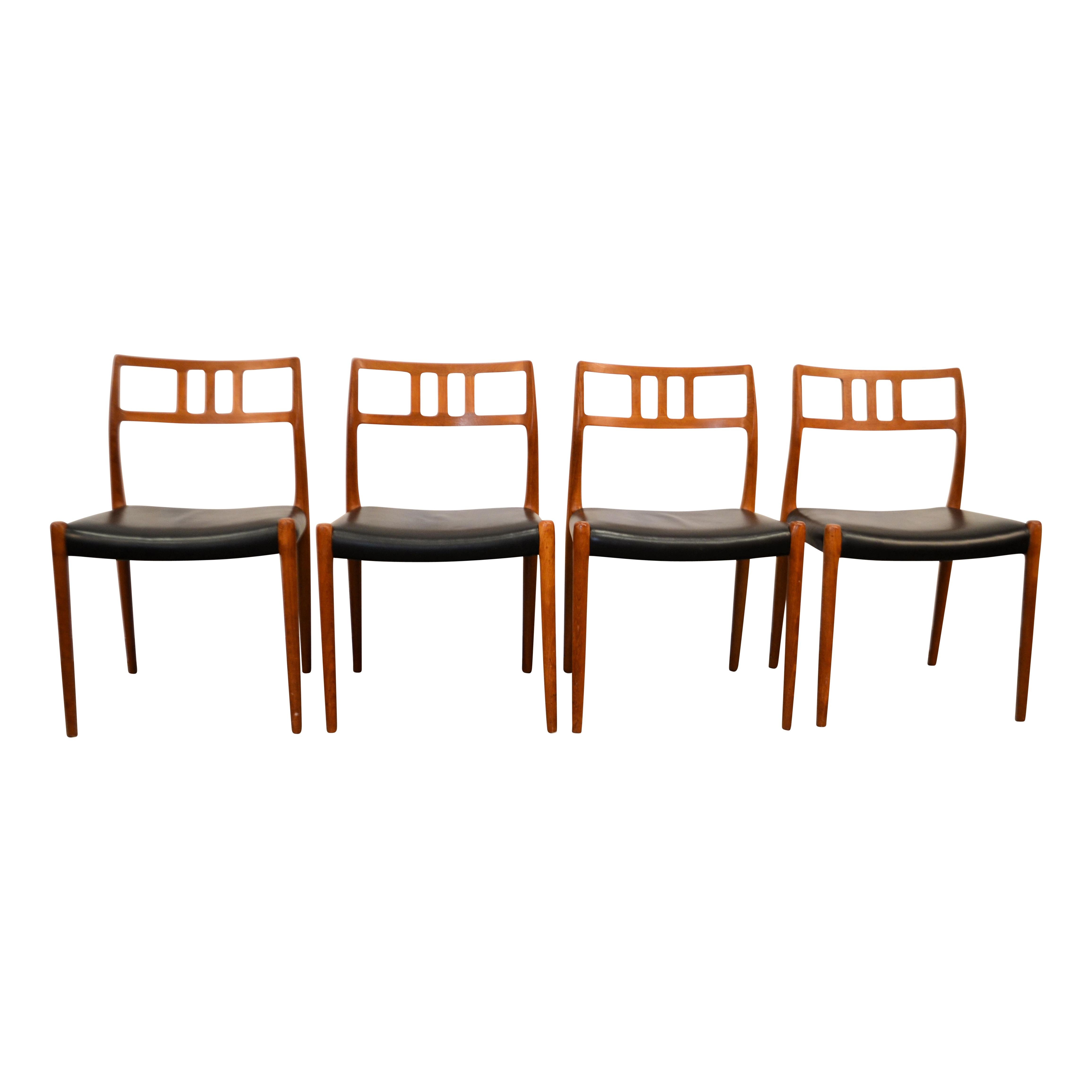 Stylish set of four vintage dining chairs. These Mid-Century Modern chairs are designed by Niels O. Møller for JL Møller Møbelfabrik in Denmark. These “no. 79” chairs feature organic design, beautiful black leather upholstery. This gorgeous set fits