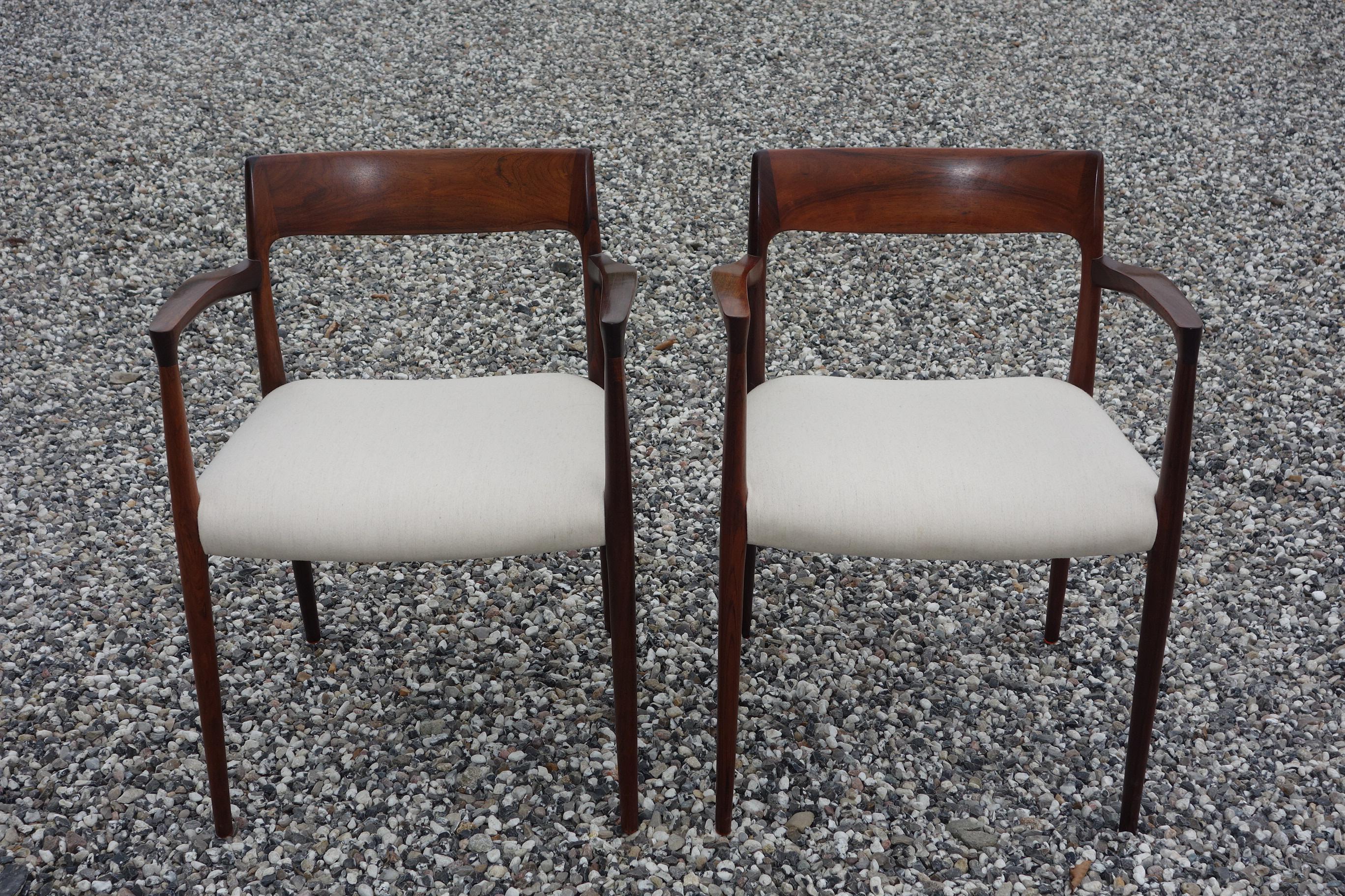 Niels O. Møller pair of armchairs model 57. Designed 1959 and made and marked from J.L. Møller furniture. Very fine condition rosewood and white wool.