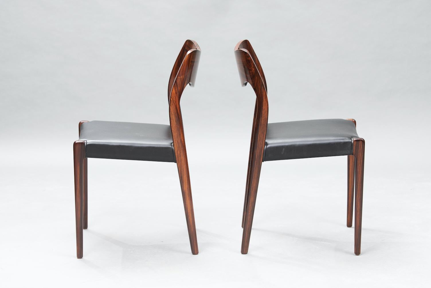 Set of six rosewood dining chairs by Niels O. Møller for J.L Møllers upholstered in black skai, model 71.
 