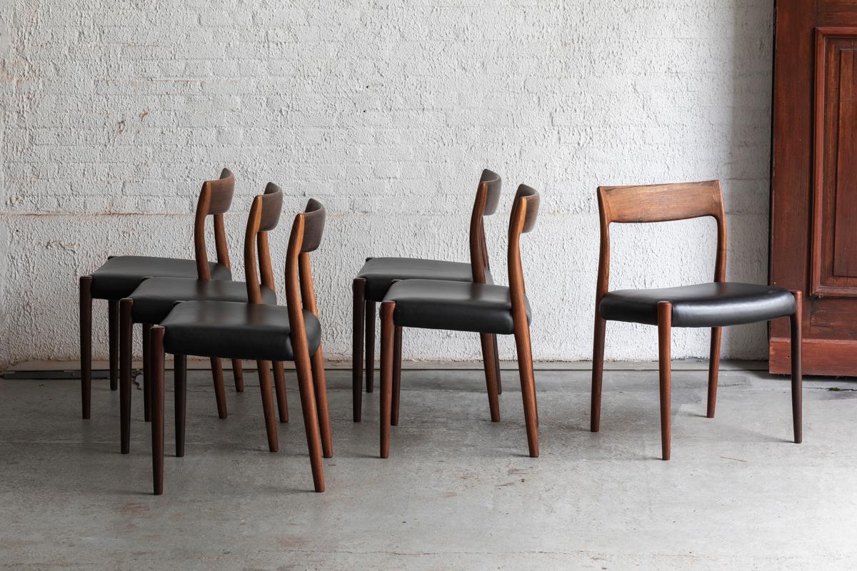 Set of 6 dining chairs ‘model 77’ designed by Niels O. Møller and produced by J.L.Møller in Denmark in the 1960’s. The chairs have a solid rosewood frame and black leather seating. A few superficial lines in the leather but further in very good