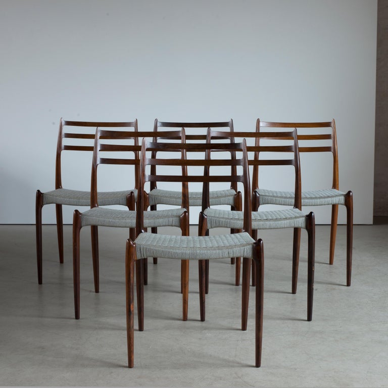 Niels O. Møller set of six rosewood chairs, seats with grey yarn. Manufactured by J. L. Møller, Denmark.