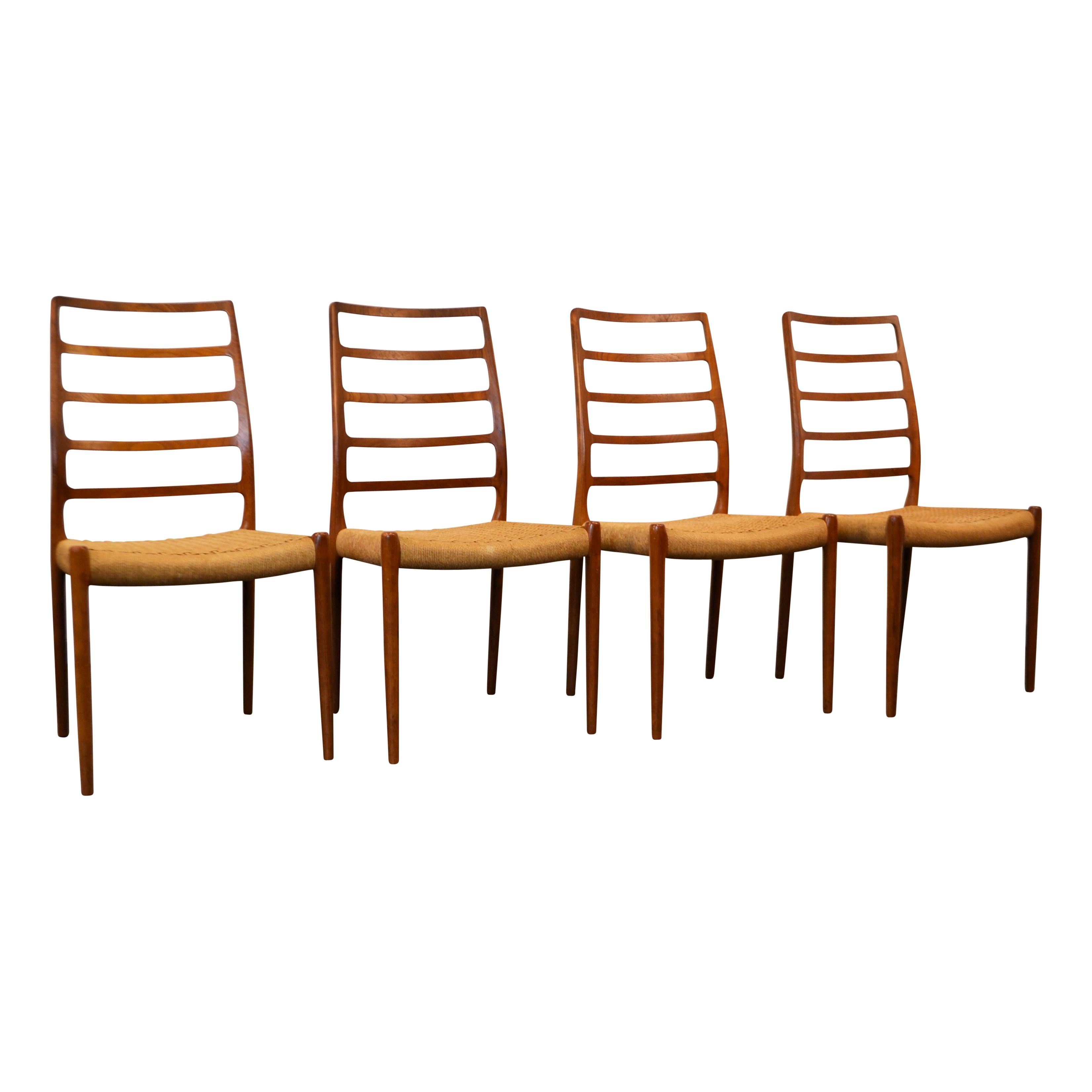 Rare set of four vintage Danish modern model #82 dining chairs designed by Niels O. Møller for J.L. Møller. Model 82 is one of Møller’s rarest and most elegant designs. This stunning Mid-Century Modern design features a gorgeous typical Danish