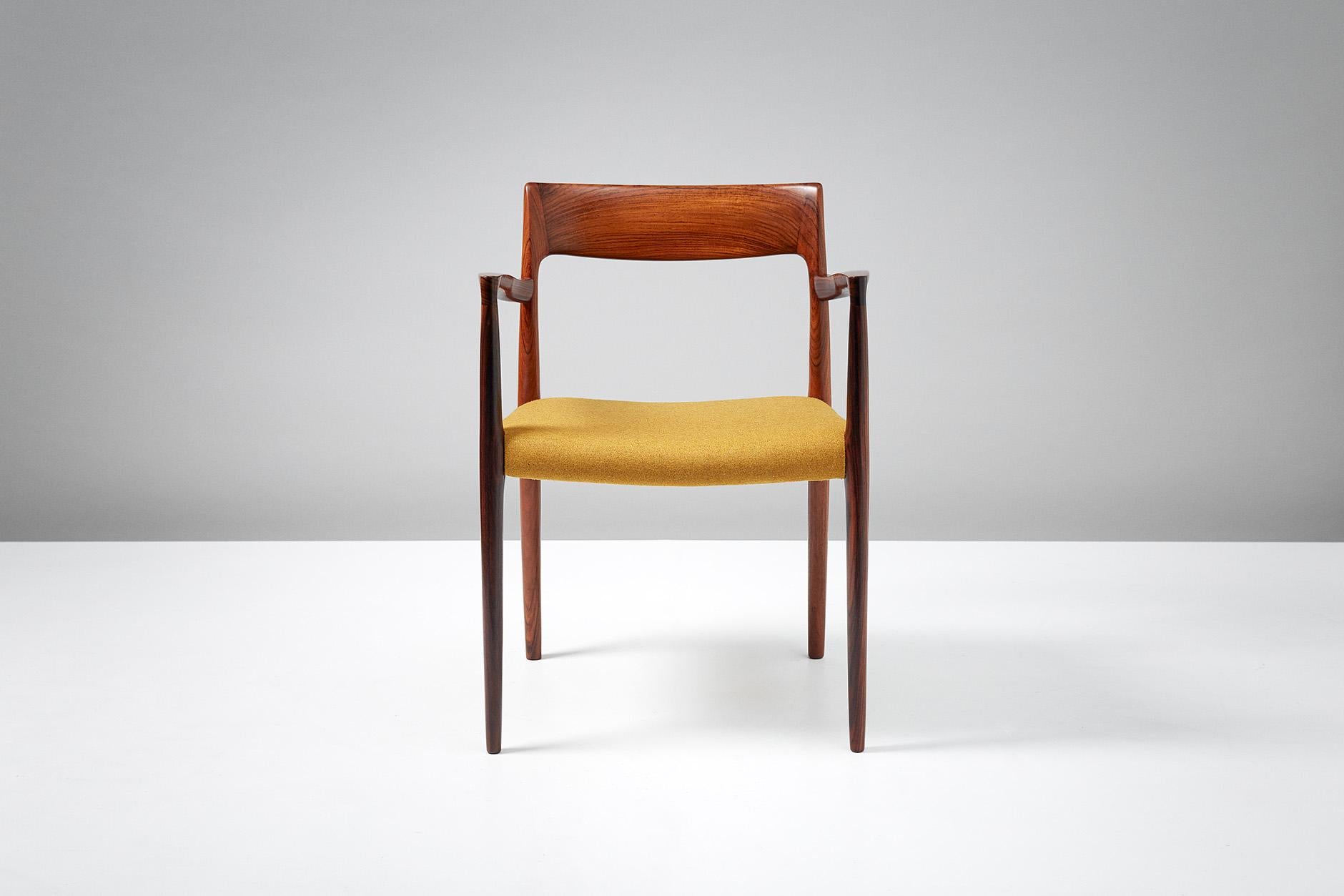 Niels O. Møller Model 57 armchair. 

Solid rosewood armchair produced by J.L. Moller Mobelfabrik, Denmark, 1959. Seat reupholstered in golden yellow wool fabric. 

Measures: H 77cm / D 50cm / W 55cm / SH 44cm.