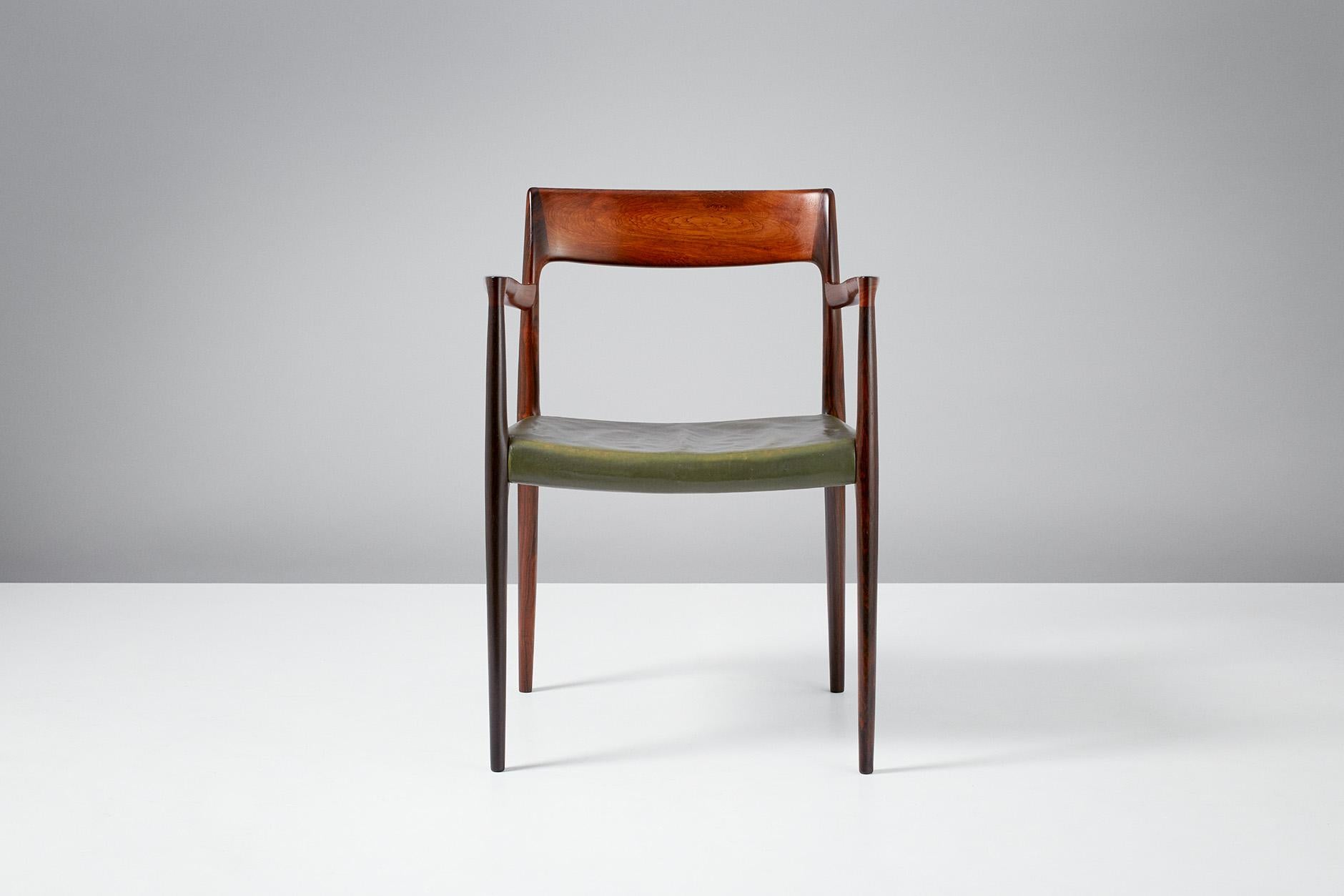 Niels O. Moller

Model 57 chair 

Solid rosewood armchair produced by J.L. Moller Mobelfabrik, Denmark, 1959. Original, patinated green leather seat.

Measures: H 77 cm / D 50 cm / W 55 cm / SH 44 cm.