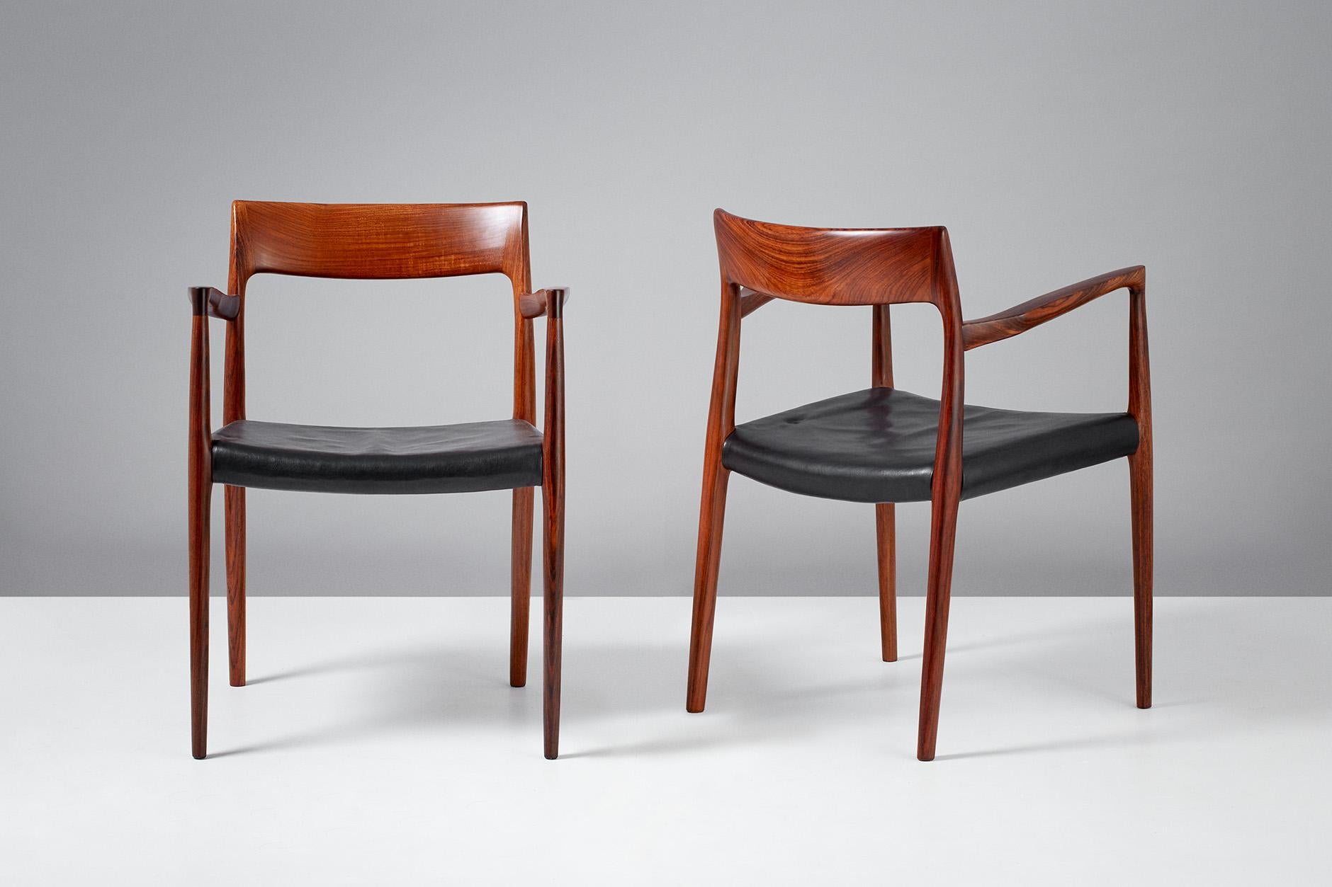 Niels O. Moller

Model 57 chairs, 1959.

Solid rosewood armchairs produced by J.L. Moller Mobelfabrik, Denmark, 1959. Original, patinated black leather seats.

Measures: H 77 cm / D 50 cm / W 55 cm / SH 44 cm.