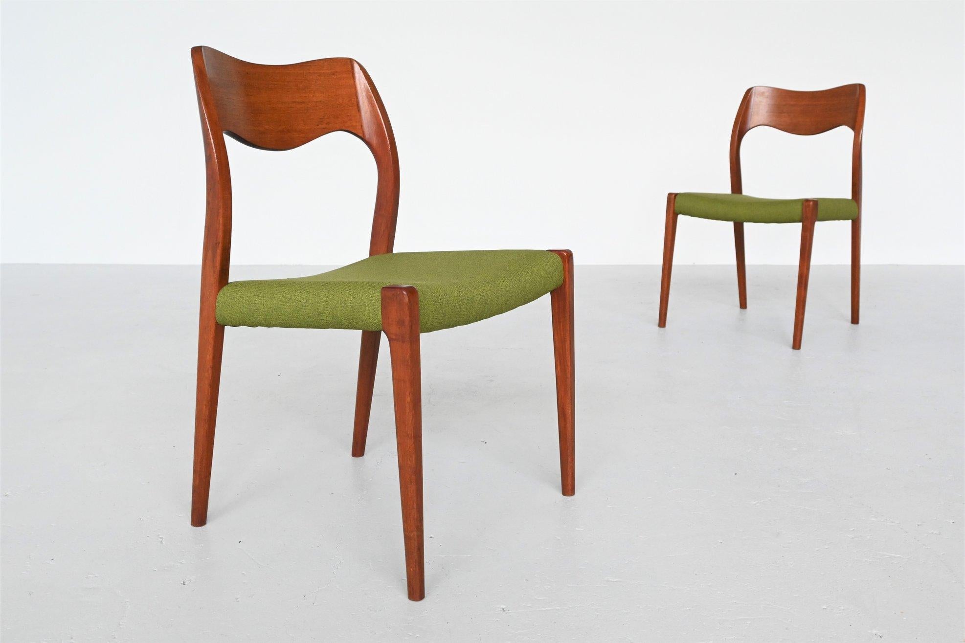 Very nice pair of dining chairs model 71 designed by Niels Otto Moller and manufactured by J.L. Møller Møbelfabrik, Denmark, 1951. These chairs are made of solid teak wood and newly upholstered with green high quality fabric. This natural green
