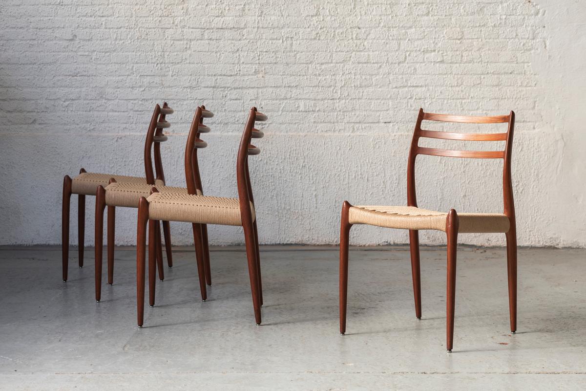Set of 4 dining chairs, model 78, designed by Niels O. Moller and produced by JL Moller in Denmark around 1960. This set features a solid teak wooden frame and woven seating. The papercord has been newly re-upholstered. Marked with the makers label