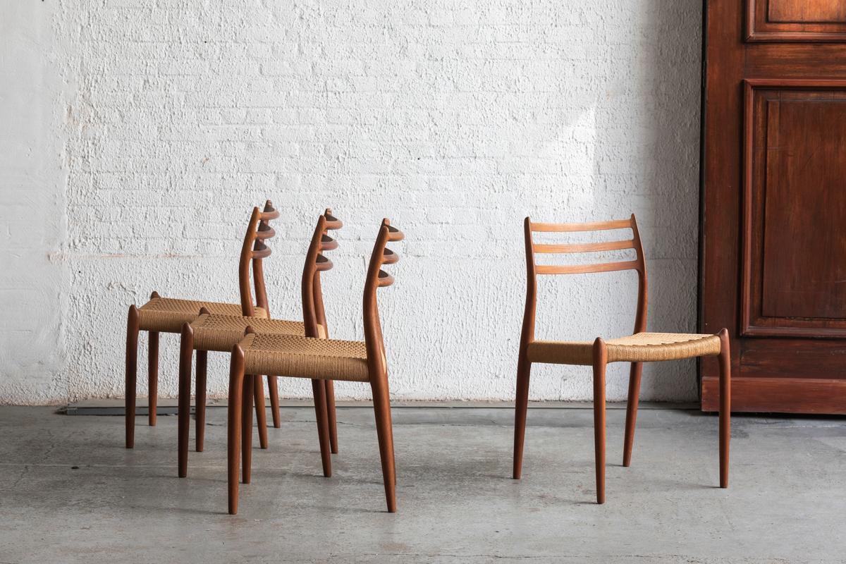 Set of 4 dining chairs, model 78, designed by Niels O. Moller and produced by JL Moller in Denmark around 1960. This set features a solid teak wooden frame and woven seating. The papercord has been newly re-upholstered. Marked with the makers label