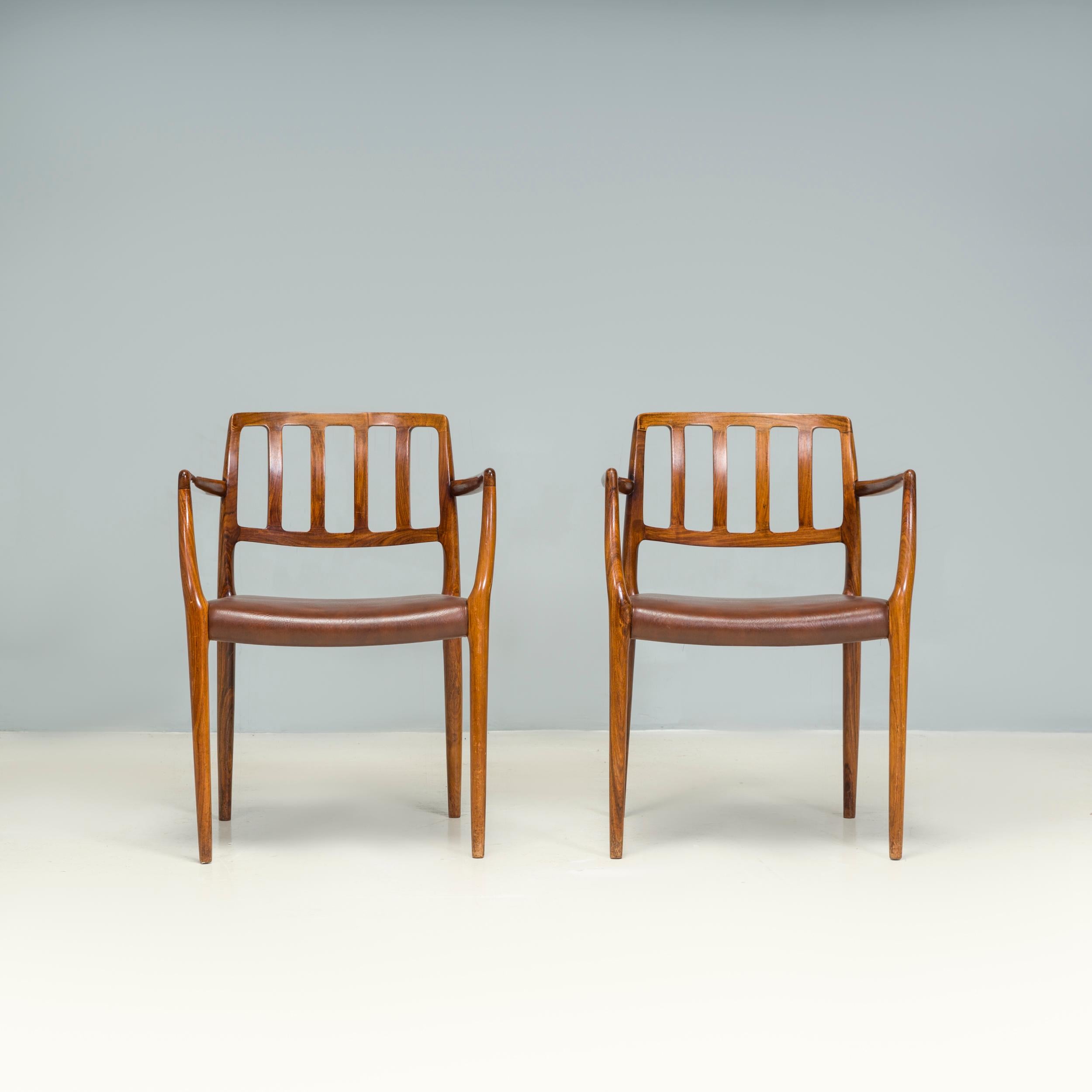 Originally designed by Niels Otto Møller in 1974, the #66 Chair was one of the most complicated designs that the company had produced.

The dining chairs feature a beautifully carved wooden frame, in a glossy finish to highlight the natural grain of
