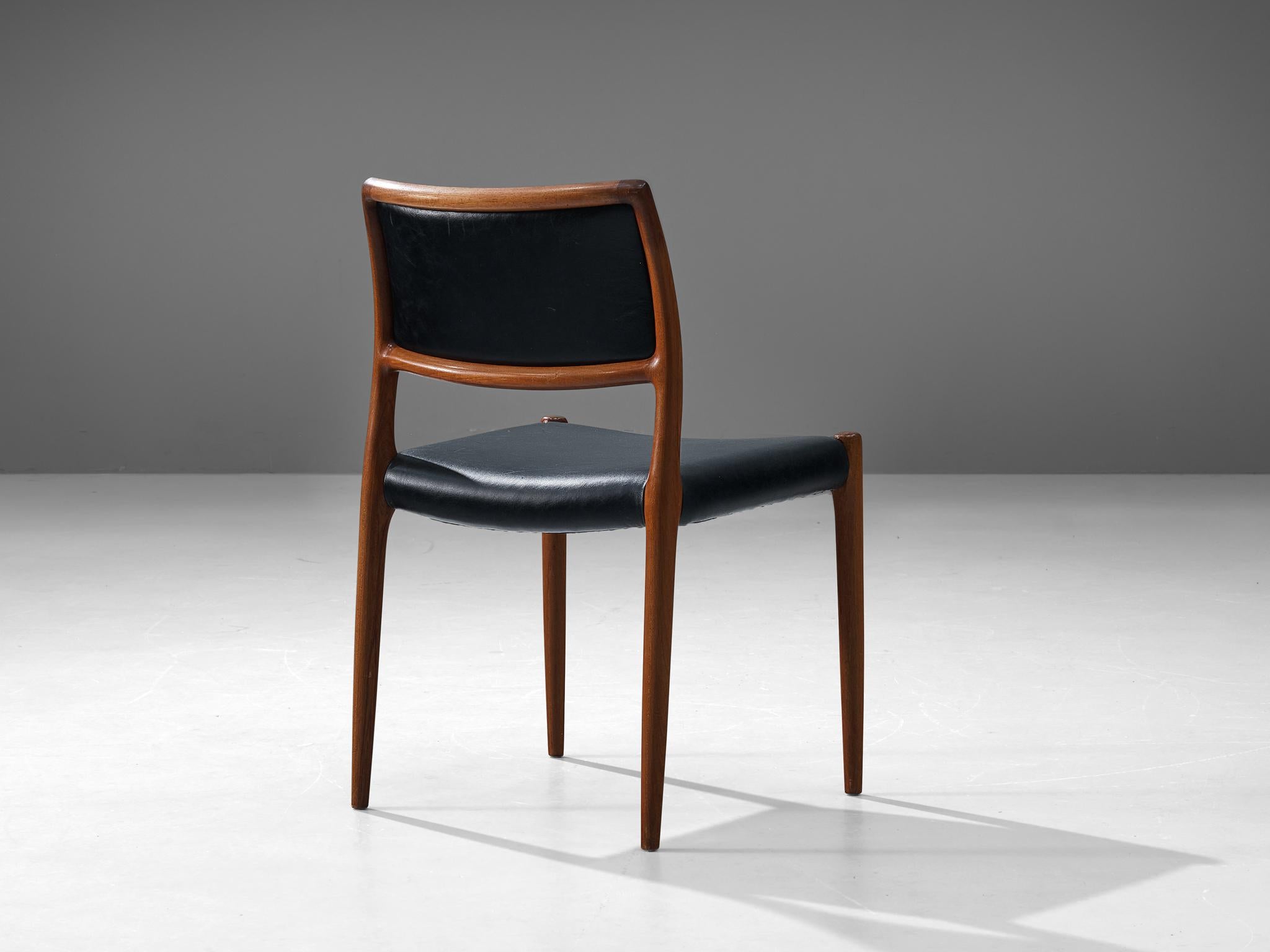 Niels Otto Møller for J. L. Møllers, dining chair, in teak and leather, Denmark, 1960s.

Refined and elegant chair designed by Niels Otto Møller in the 1960s. The elegant designed open shape of the frame in combination with upholstery makes this