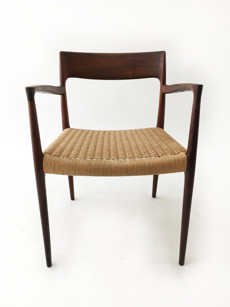 Beautiful vintage Niels Otto Møller, model 57 Carver armchair, made in Denmark 1958. The chair retains the original paper cord in very good condition. A truly classic midcentury Danish design to upgrade any room. Signed with Danish Makers & J.L.