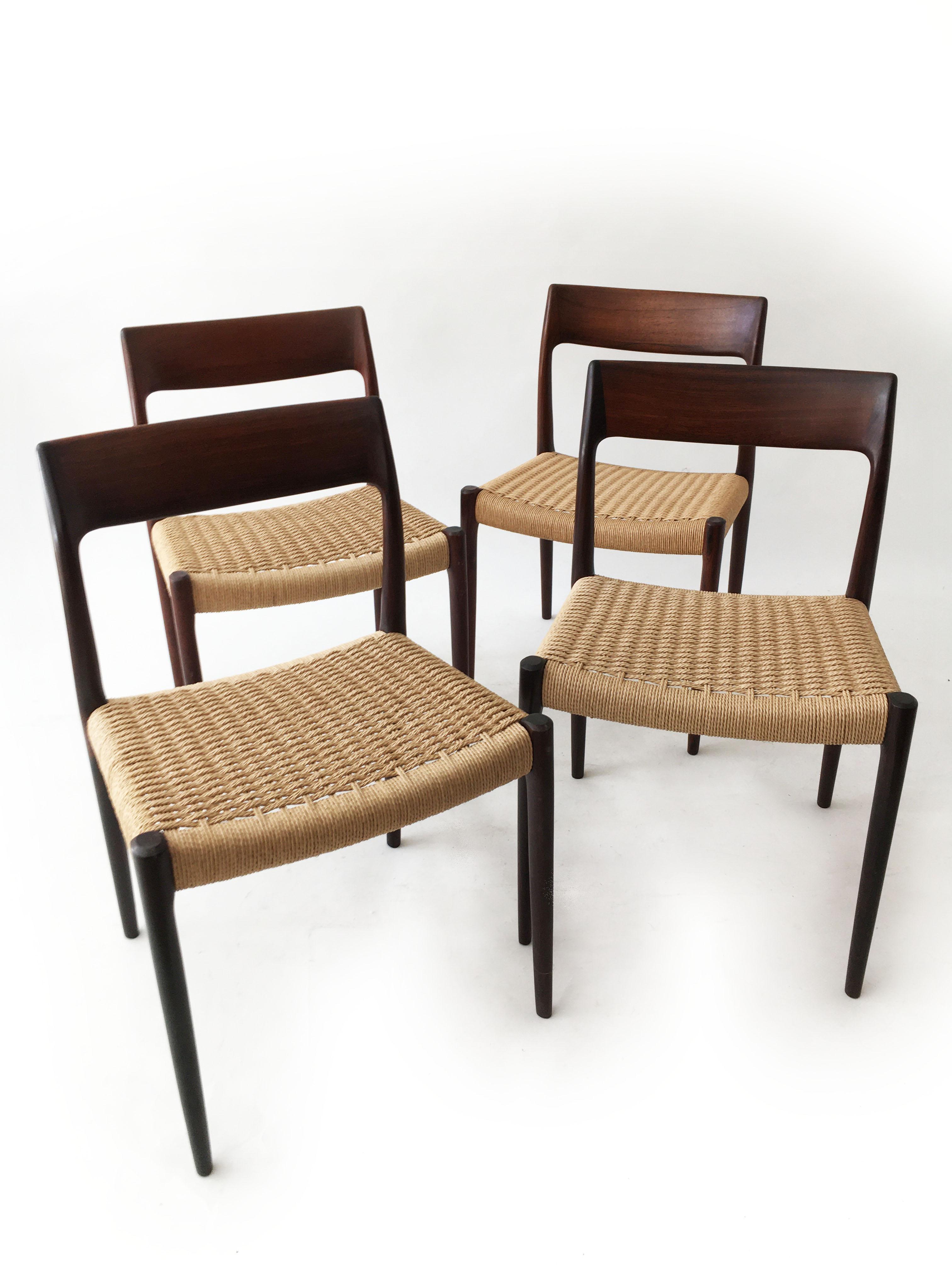 Wonderful vintage Niels Otto Møller, model 77 set of four modern Danish dining chairs, Denmark, 1958. The chairs retain the original paper cord in very good condition. A truly Classic midcentury Danish design to upgrade any room. Signed with Danish