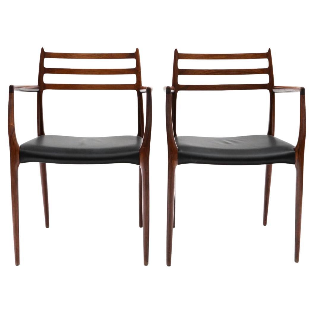Niels Otto Møller - Pair of Rosewood and Black Leather Arm Chairs Model 62