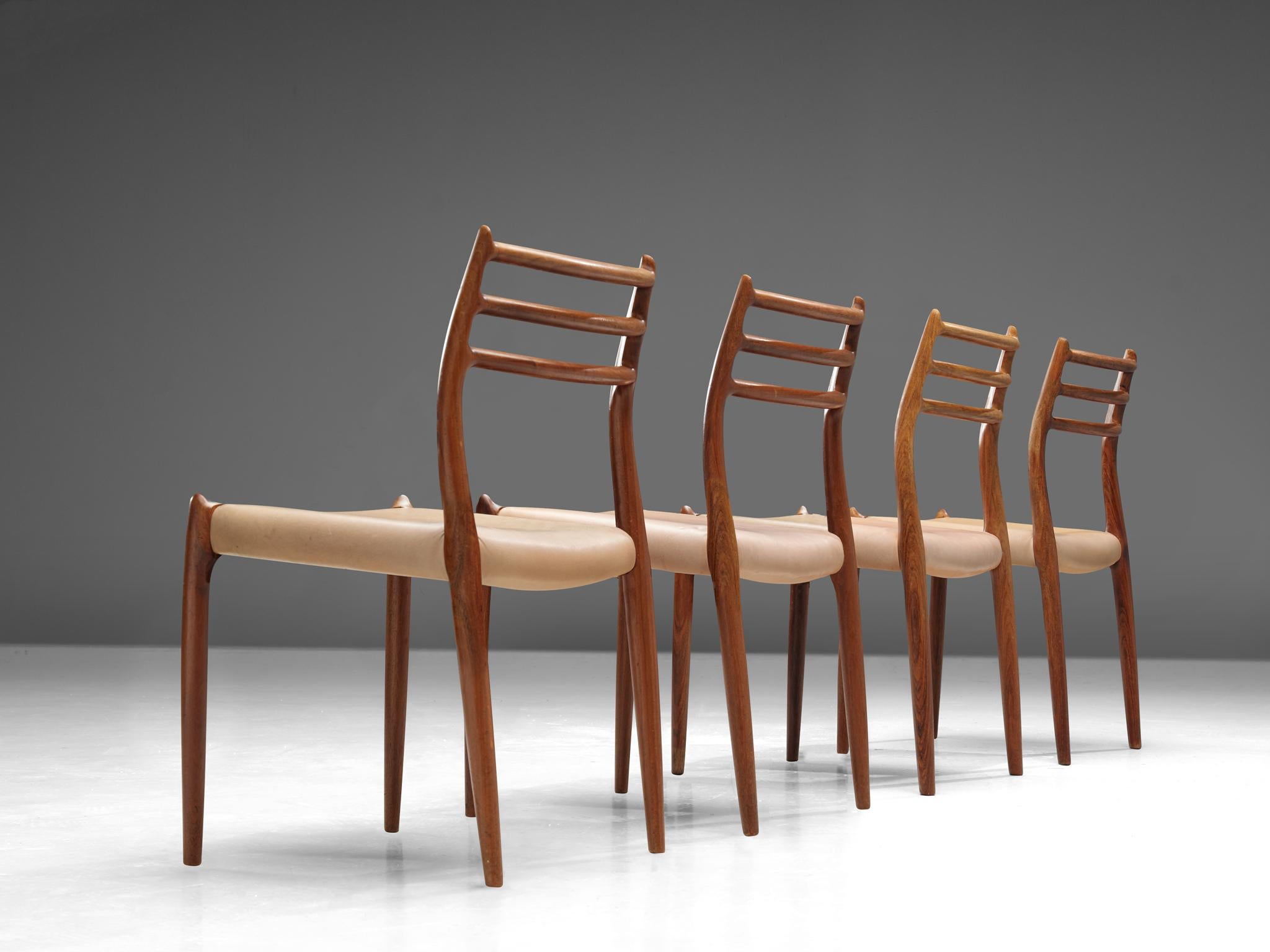 Niels Otto Moller, for J.L. Møllers Møbelfabrik, set of four dining chairs 'model nr. 62', in rosewood and leather, Denmark, 1960s.

Set of four rosewood dining chairs with different upholsteries, with our without armrests. This design, 'model nr.