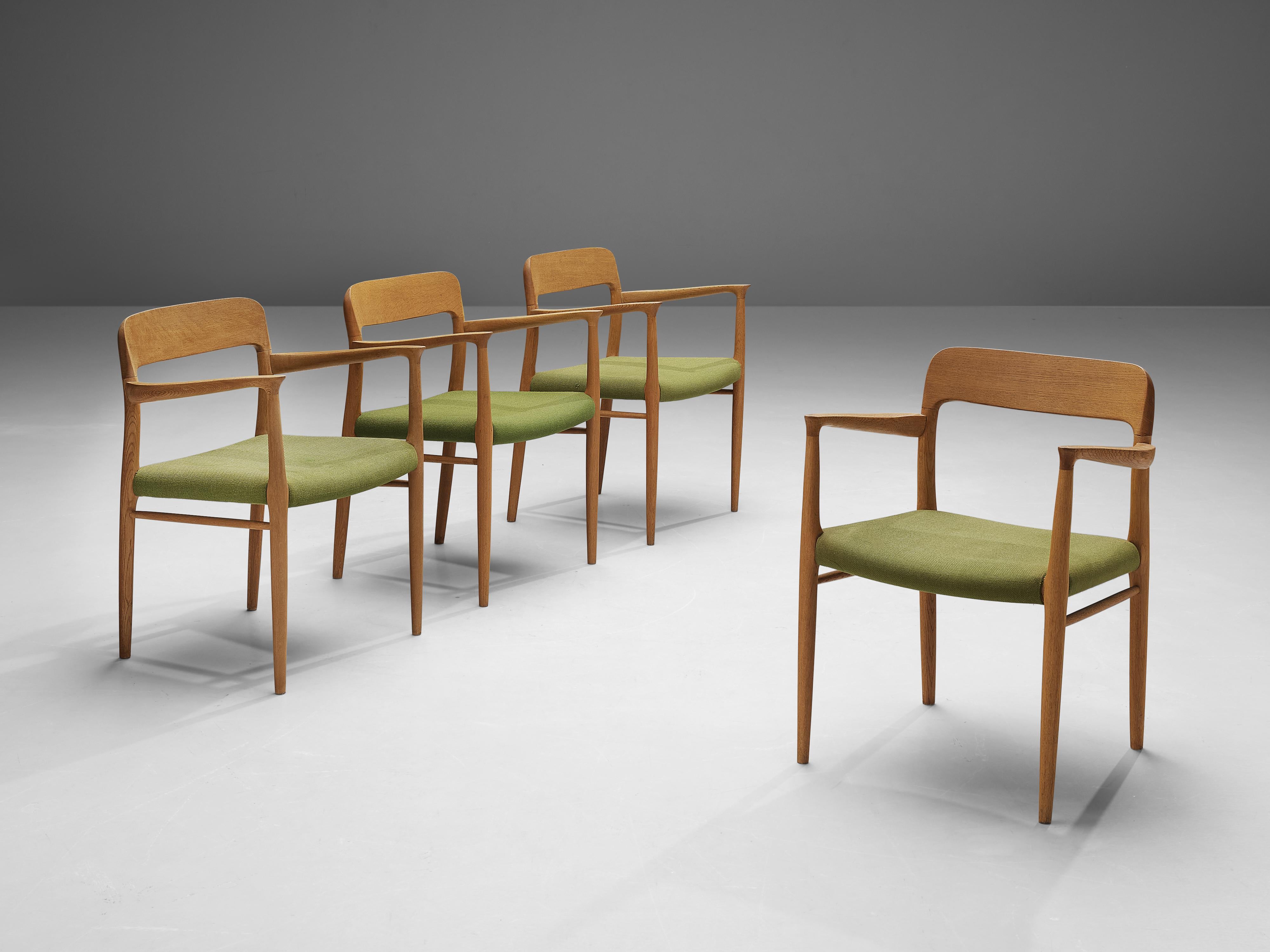 Niels Otto Møller for J. L. Møller, set of four dining chairs model ‘56’, oak, fabric, Denmark, 1954

This set of chairs shows subtle lines and beautiful curves in the woodwork. In the highly refined connections of the wood you can see the work of