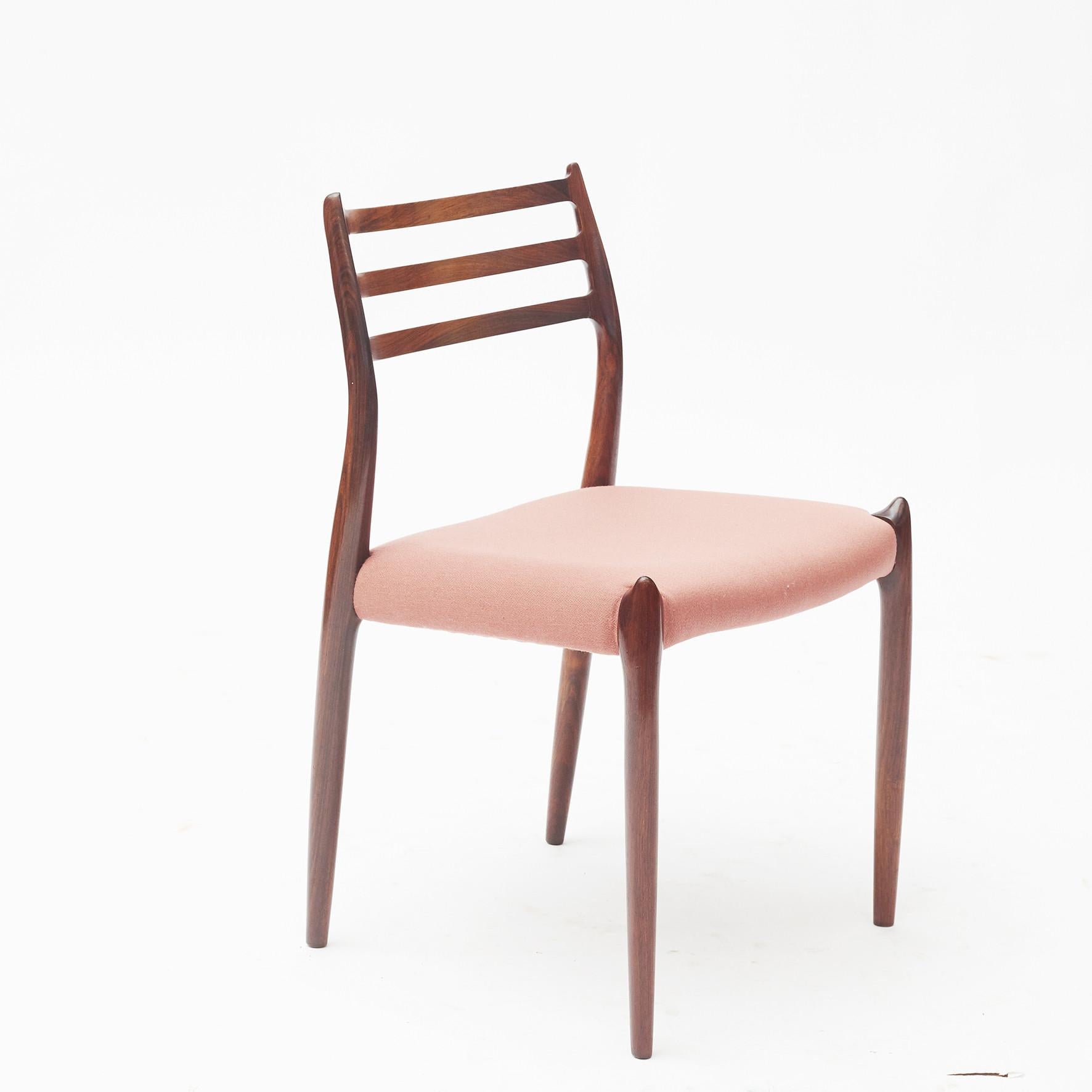 Niels Otto Møller, for J.L. Møllers Møbelfabrik.
Set of six dining chairs 'model nr. 78', in teak (Afromosia) and pale pink upholstery, Denmark, 1960s.
  