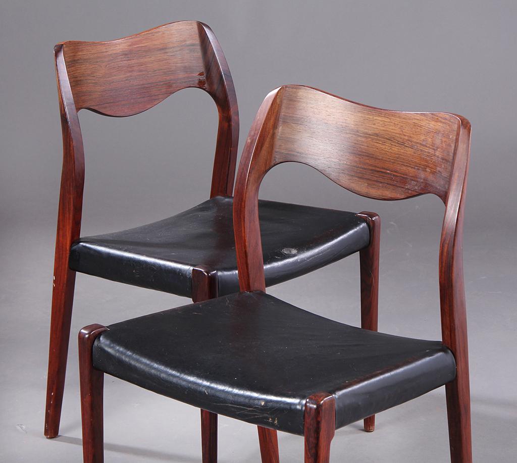 Pictured is a set of six dining chairs designed by Niels Otto Moller in 1951 and made by JL Moller before 1969, as indicated by the round disc label. Original black leather is in fair condition showing cracking and marks from normal wear and tear.