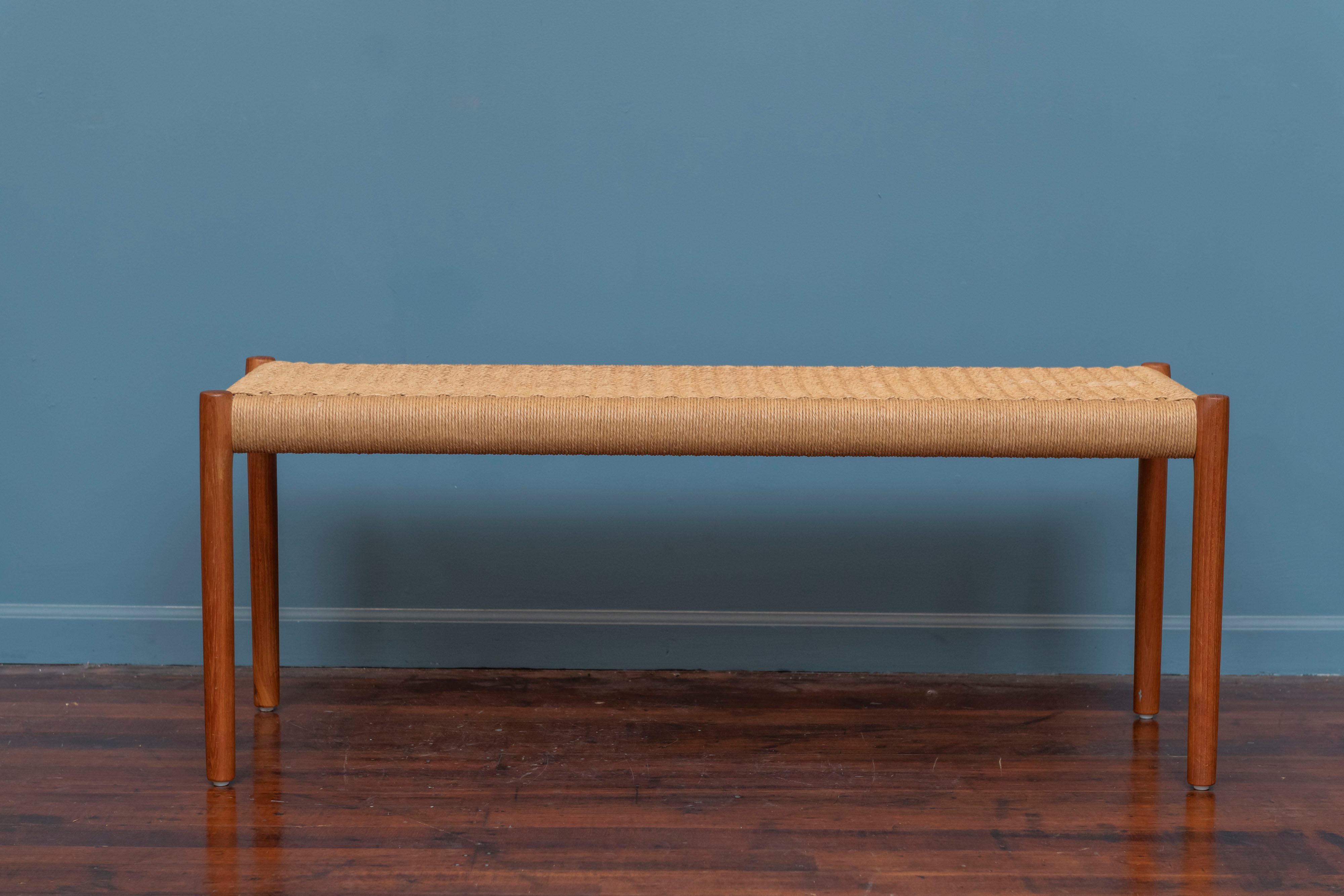 Niels Otto Moller teak and papercord bench, Model 63A. Vintage original danish teak bench in very good original condition with one almost unnoticeable small faded area. Ready to install.