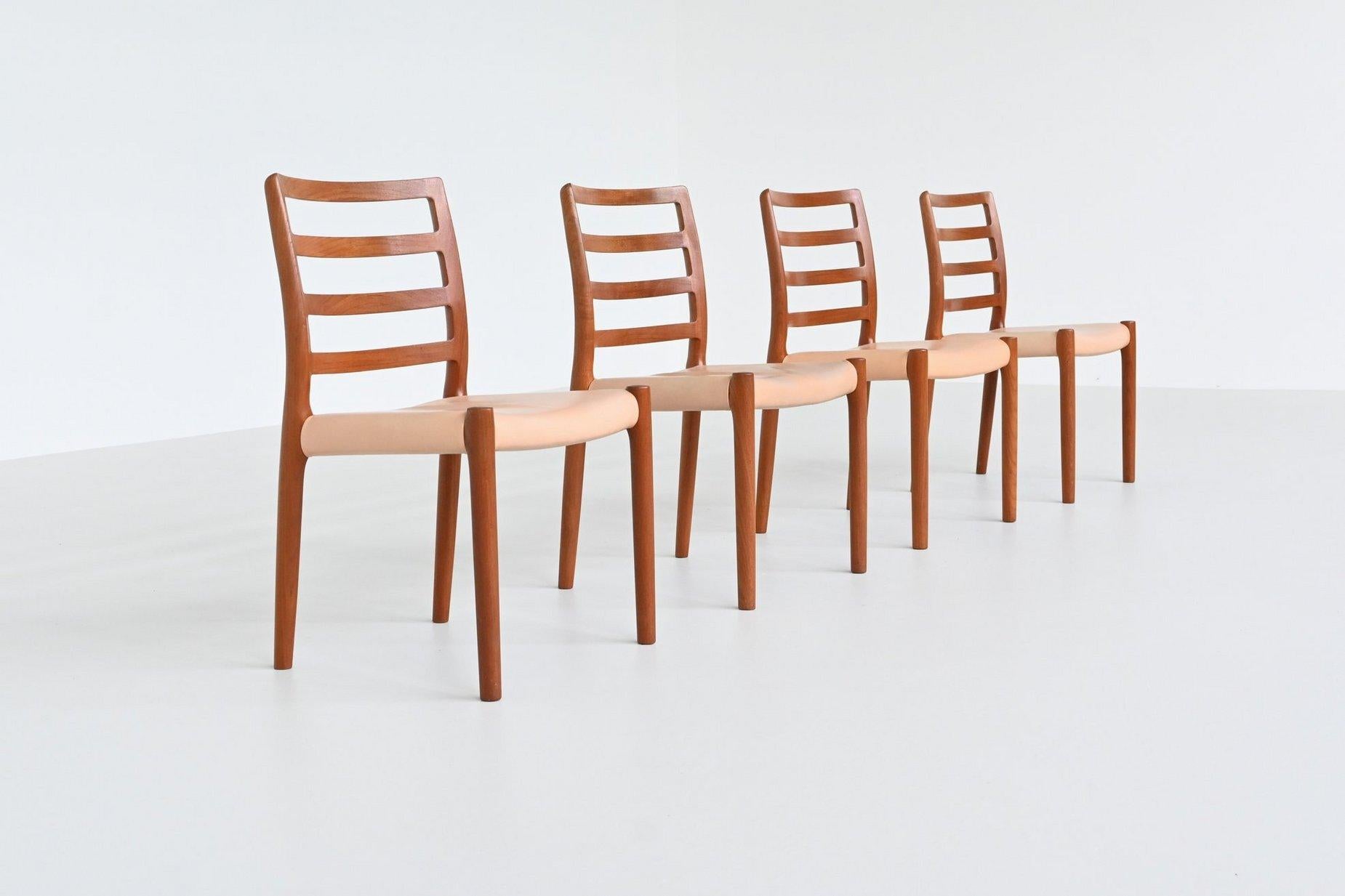 Very nice set of four dining chairs model 85 designed by Niels Otto Møller and manufactured by J.L. Møller Mobelfabrik, Denmark 1960. These iconic chairs are made of solid teak and the seats are covered with original crème white leather. The back
