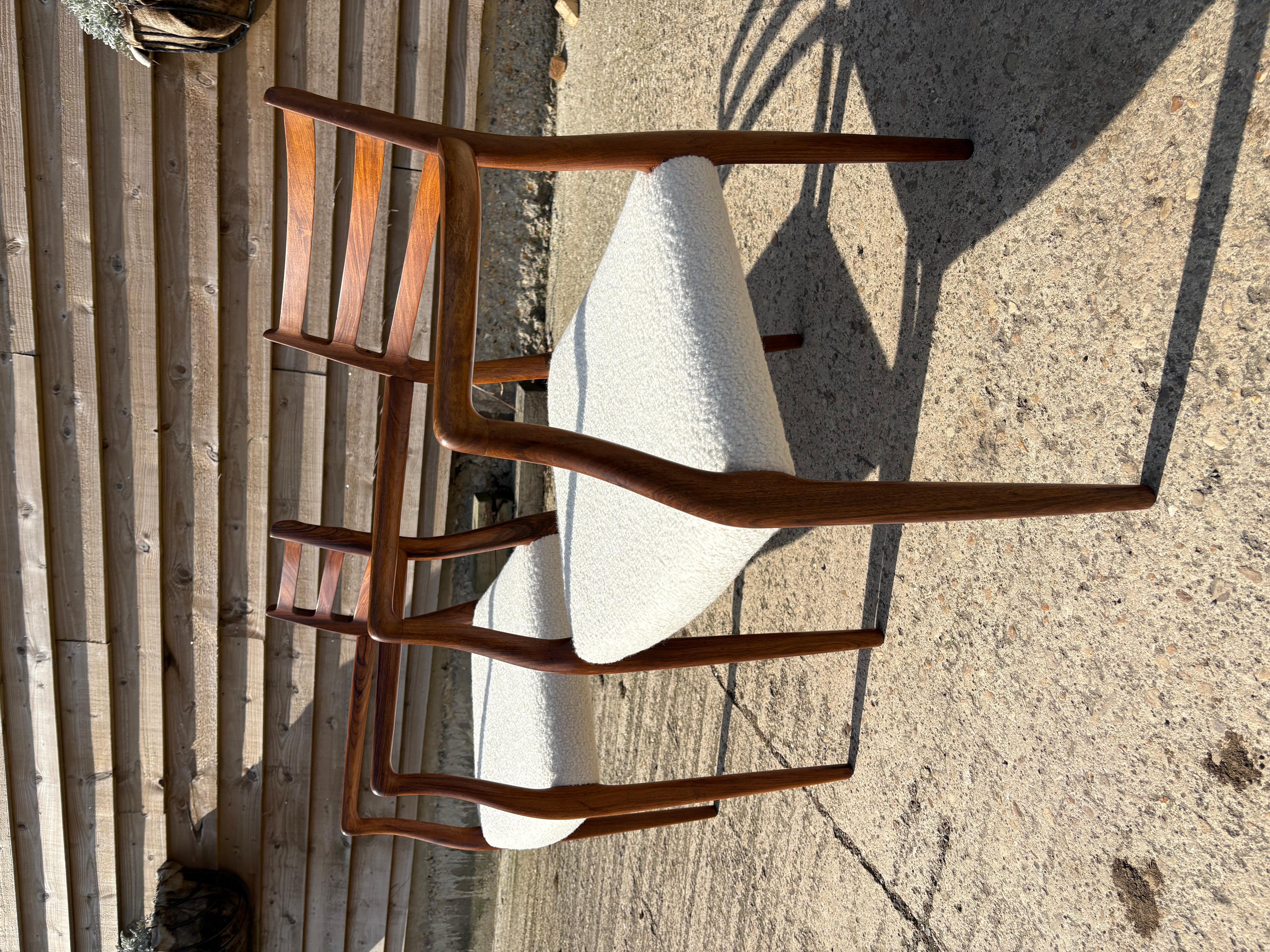 This pair of Niels Otto Moller's Model 62 dining chair is made up of one chair with a round metal label and the other chair without any label.  Despite these differences the wood colour and tone is very similar. Both have been reupholstered in wool
