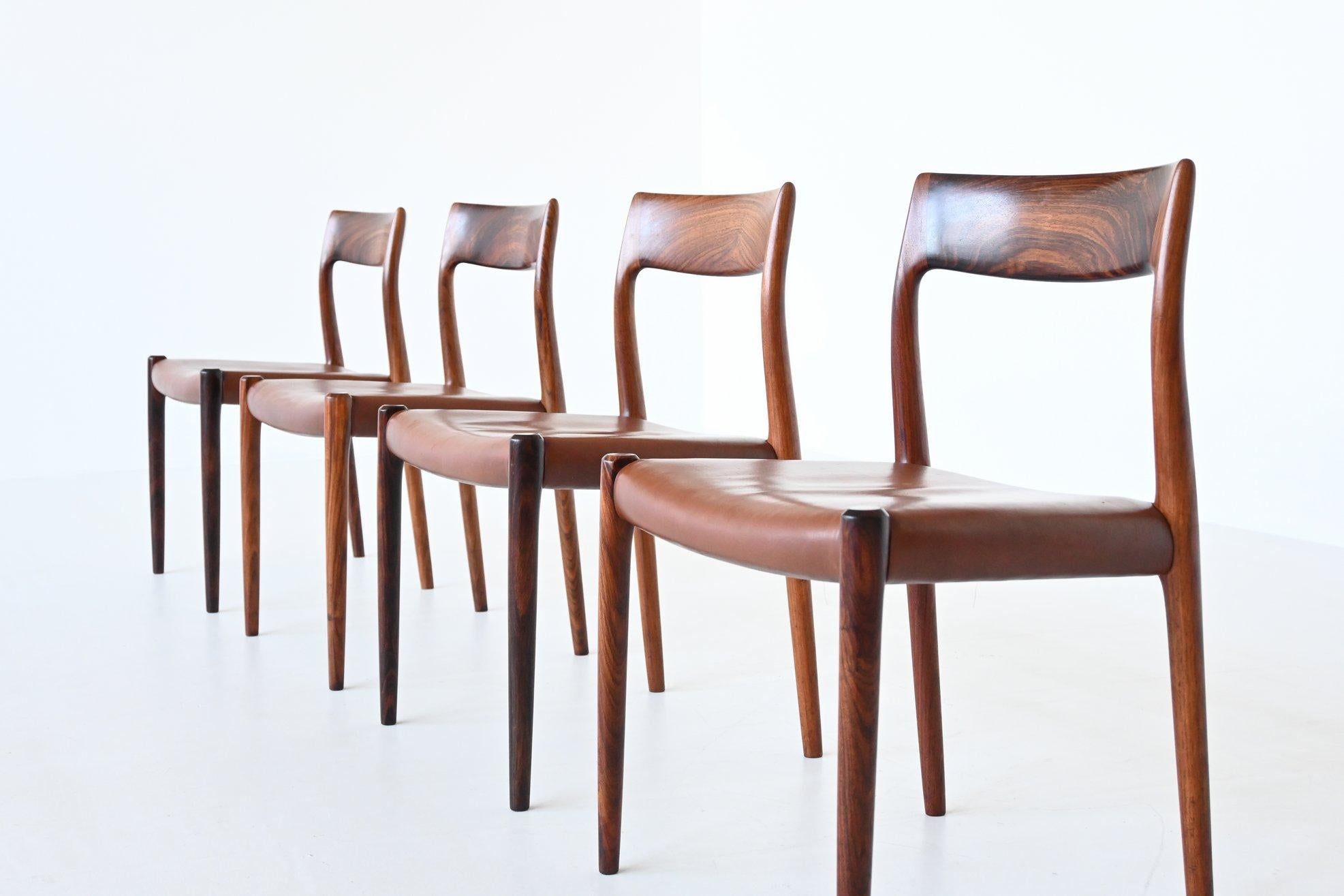 Very nice set of four dining chairs model 77 designed by Niels Otto Møller and manufactured by J.L. Møller Mobelfabrik, Denmark 1960. They are made of beautiful expressive grained solid rosewood and the seats are upholstered with original