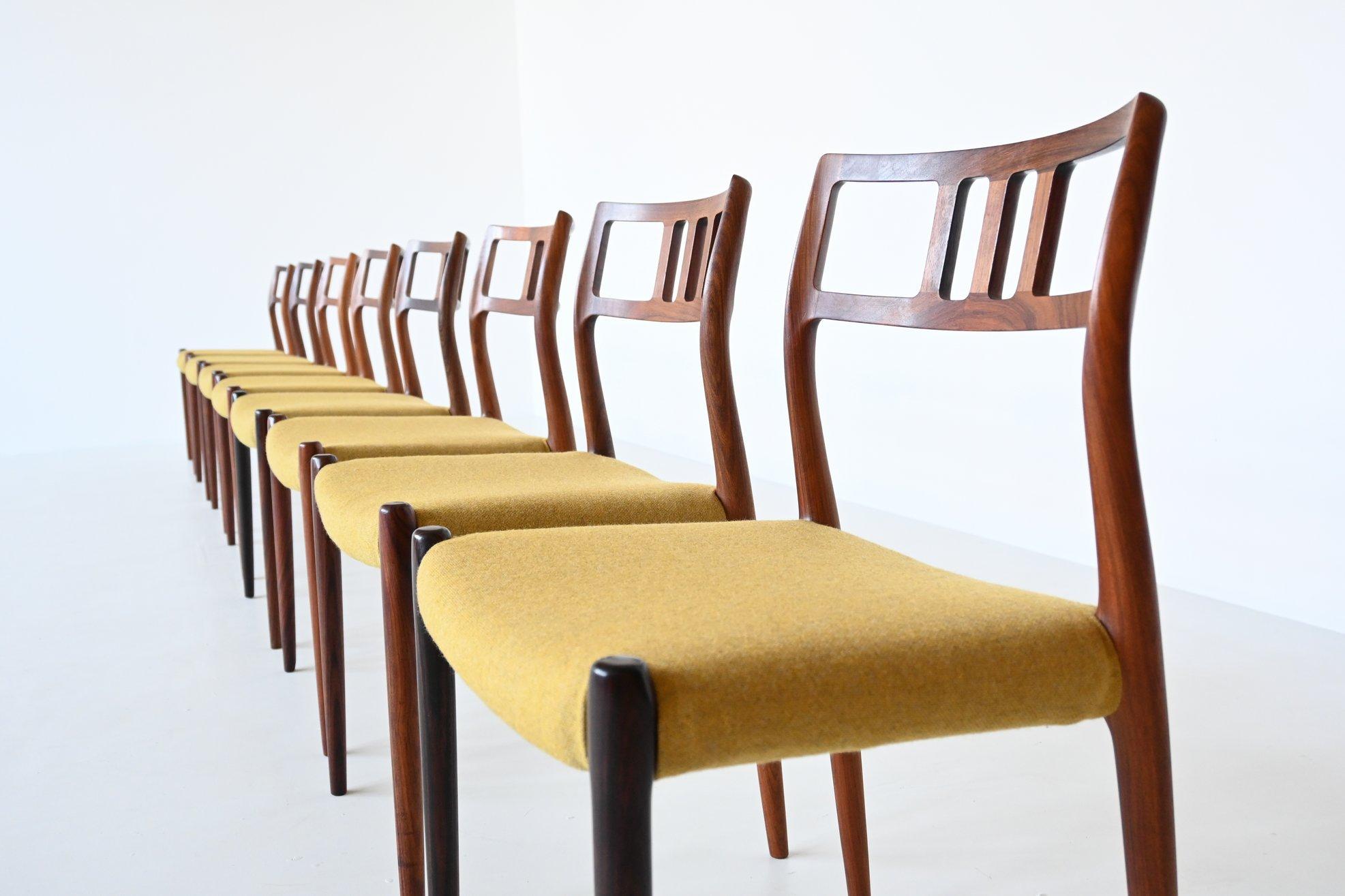 Very nice large set of eight dining chairs model 79 designed by Niels Otto Moller and manufactured by J.L. Møller Mobelfabrik, Denmark 1960. These chairs are made of solid rosewood and the seats are upholstered with yellow white mixed wool fabric.
