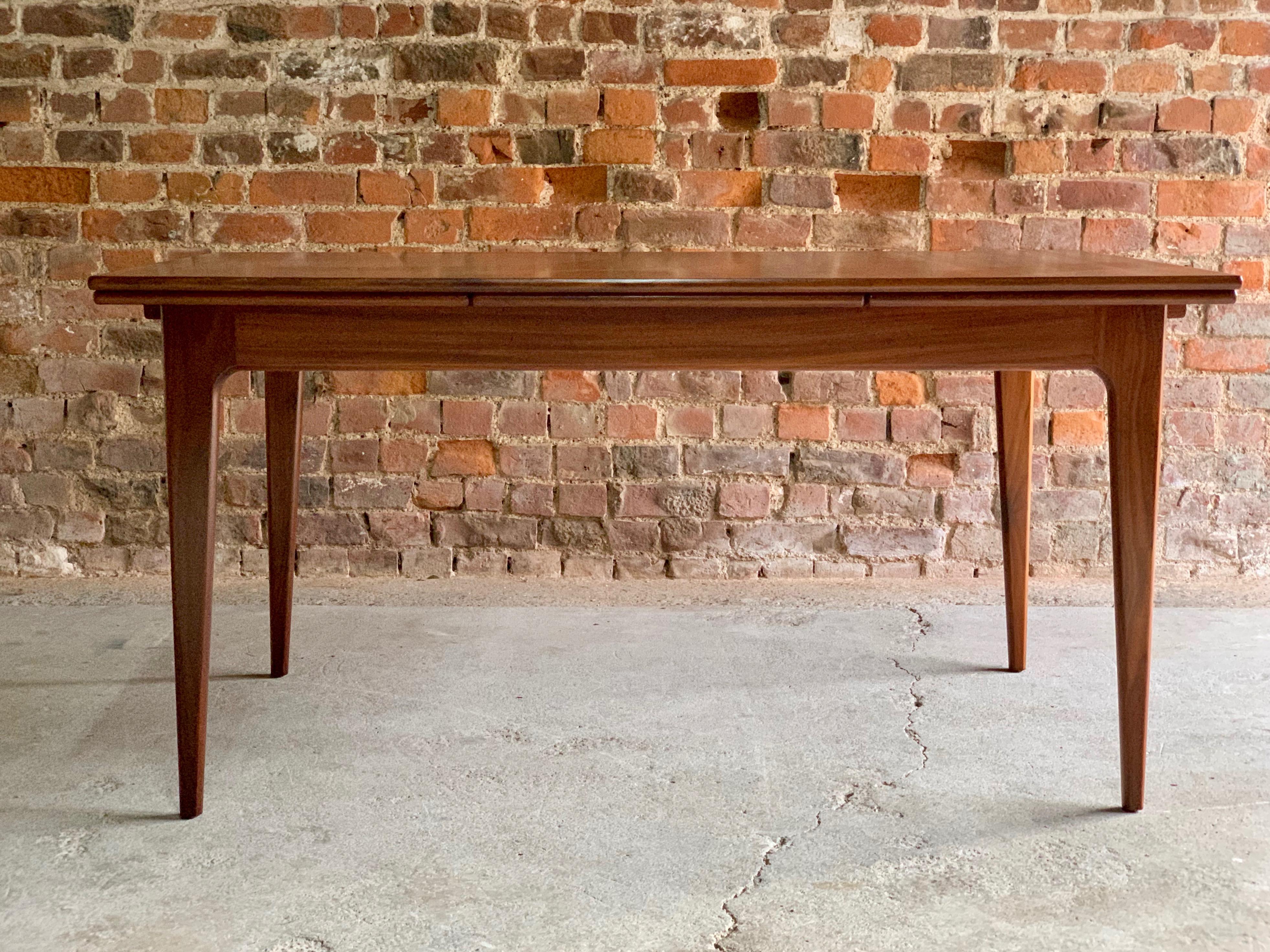 
Niels Otto Moller teak draw leaf dining table midcentury Danish, circa 1970s

Midcentury Danish design Niels Otto Moller for J.L. Moller teak draw leaf dining table, circa 1970s, The teak extending tabletop includes two leaves that store