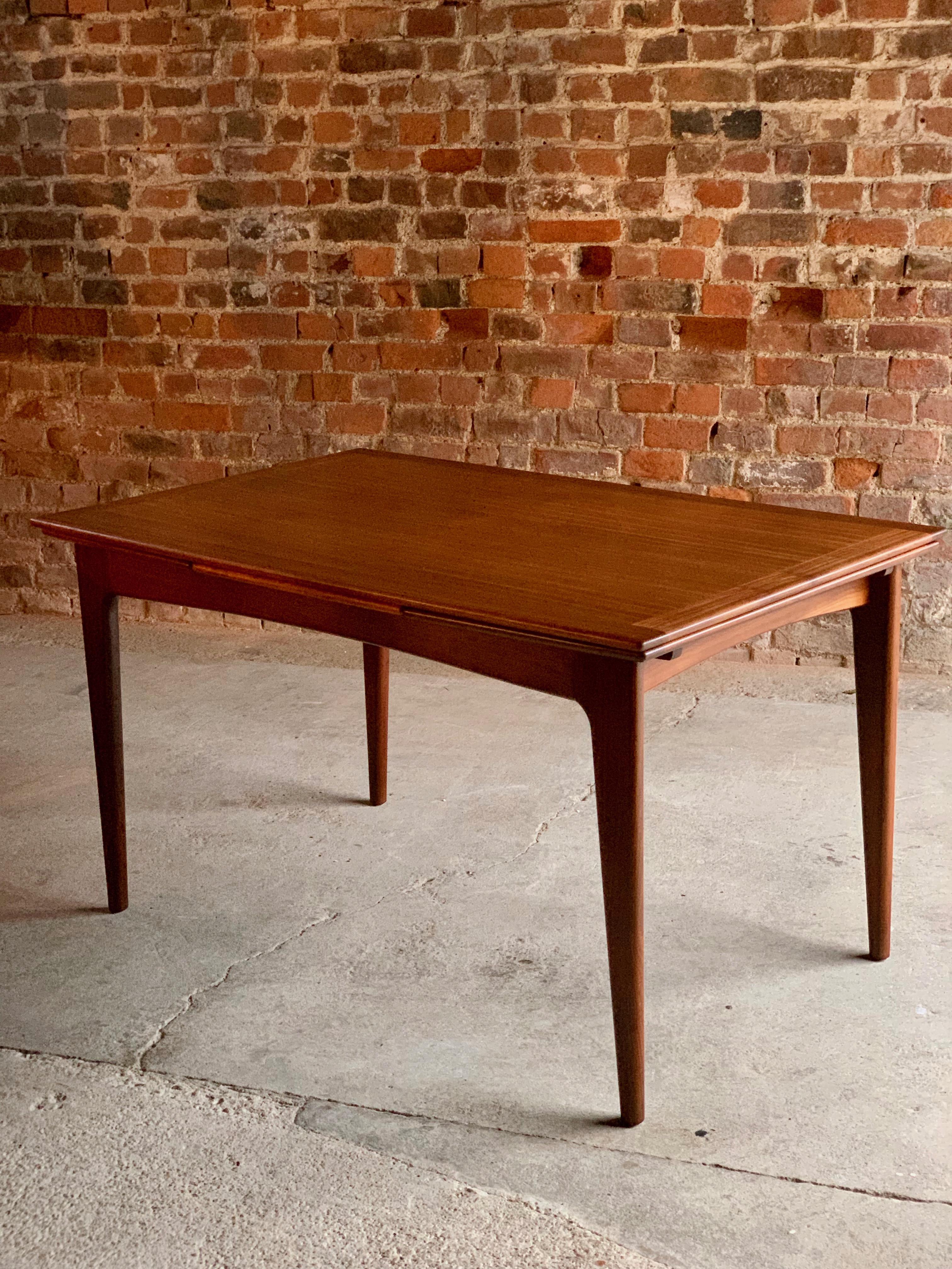 A magnificent midcentury teak extending dining table by Danish designer Niels Otto Møller, and manufactured by JL Møllers Møbelfabrik circa 1960, this table has been completely refurbished and is offered as new, the table has two leaves that