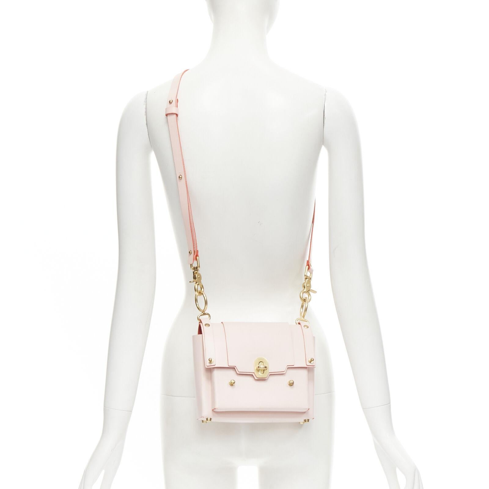 NIELS PEERAER Recycle pink Vegetable leather top handle half moon bag
Reference: KNCN/A00023
Brand: Niels Peeraer
Material: Leather
Color: Pink
Pattern: Solid
Closure: Turnlock
Extra Details: Vegetable tan leather. Gold-tone hardware. O-ring with