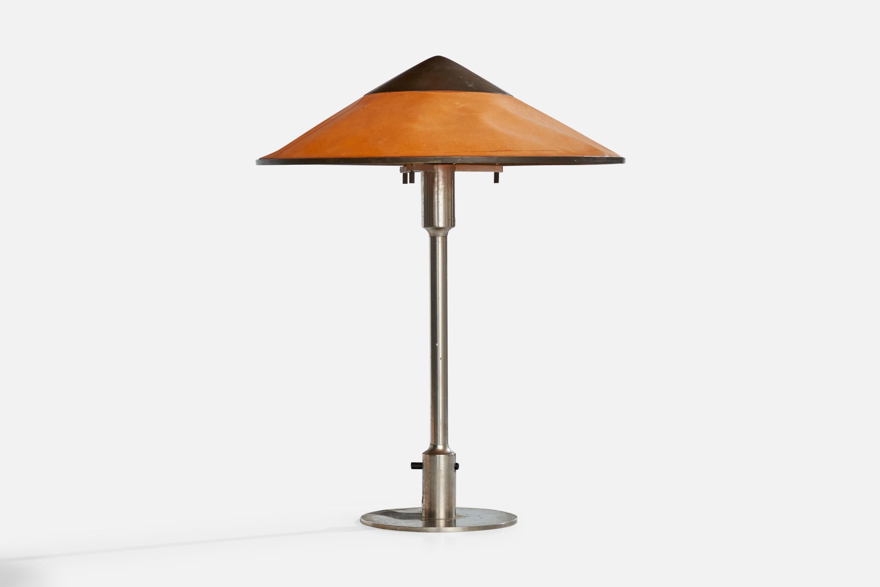 A nickel, waxed orange paper and copper table lamp designed and produced by Niels Rasmussen Thykier, Denmark, 1930s.

Dimensions of Lamp with Shade (inches): 18.5” H x 14.75“ Diameter

Bulb Specifications: E-26 Bulb

Number of Sockets (per fixture):