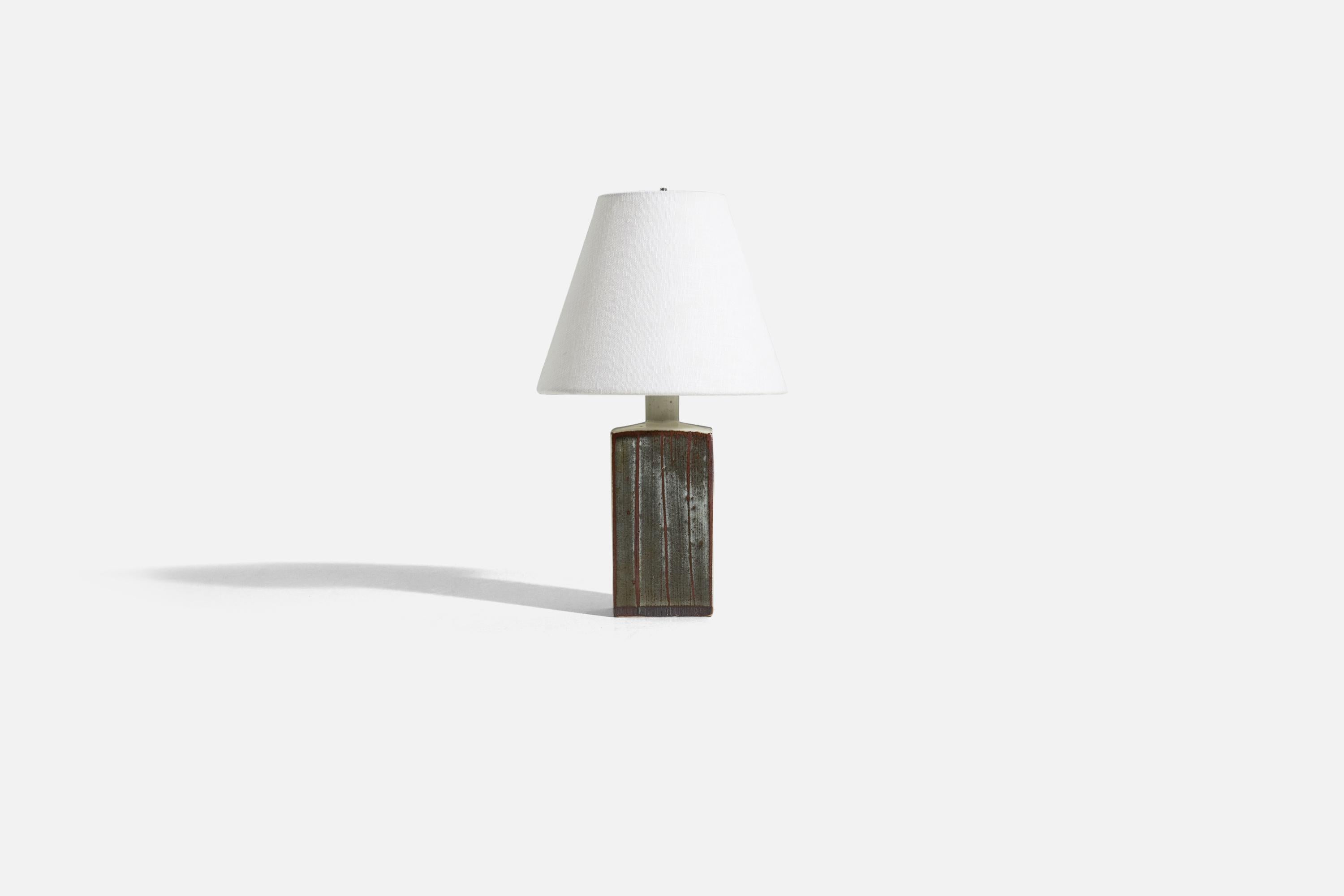 A glazed stoneware table lamp, designed and produced by Niels Refsgaard, Denmark, 1960s.

Sold without lampshade. 
Dimensions of Lamp (inches) : 10 x 3.25 x 2.625 (H x W x D)
Dimensions of Shade (inches) : 4 x 8 x 6.75 (T x B x H)
Dimension of