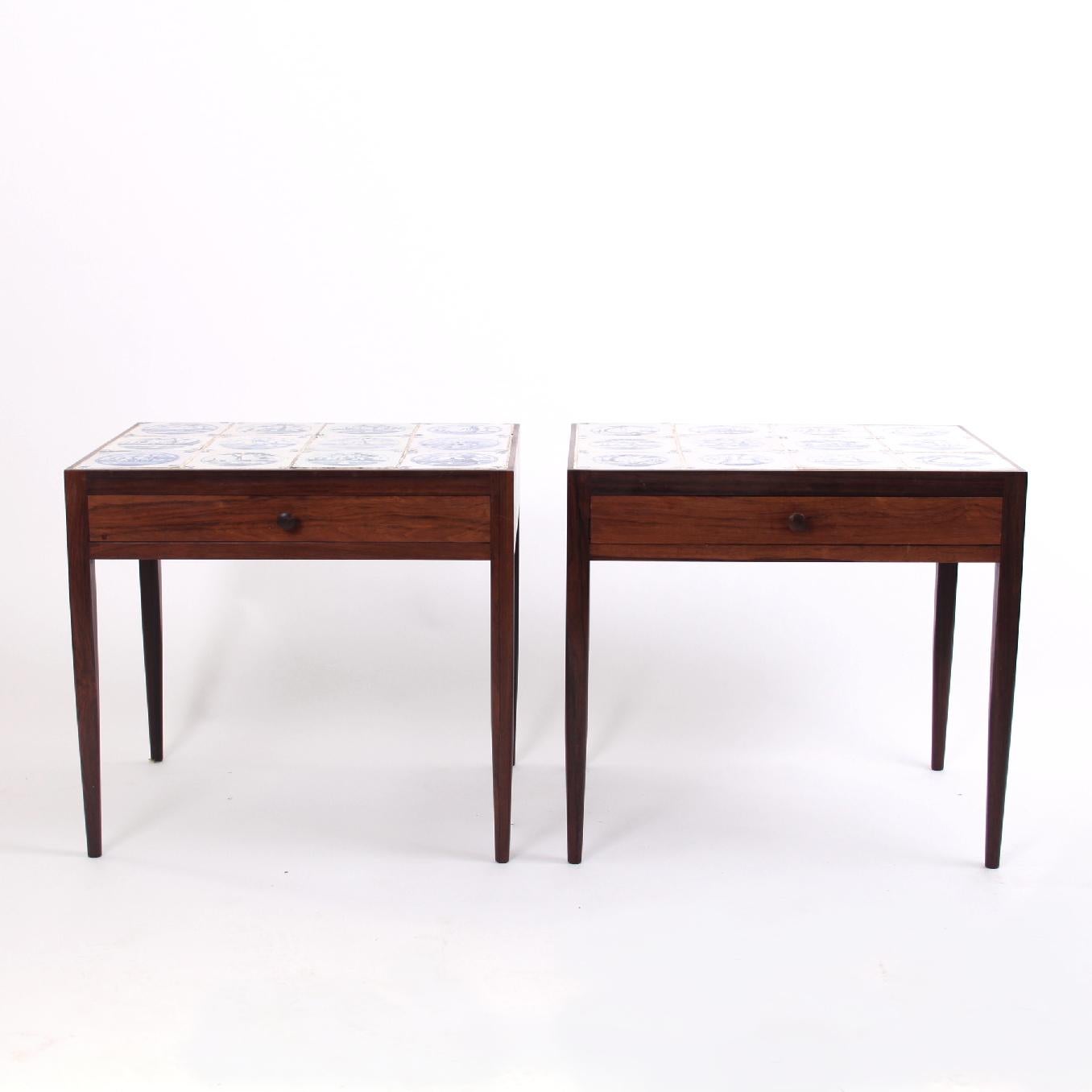 Niels Vodder-Scandinavian modern. 

The close companion of Finn Juhl, Niels Vodder, is the designer and cabinetmaker of these beautiful and rare side tables in rosewood and antique Delft tiles. The mixture of classic tiles and high-grade
