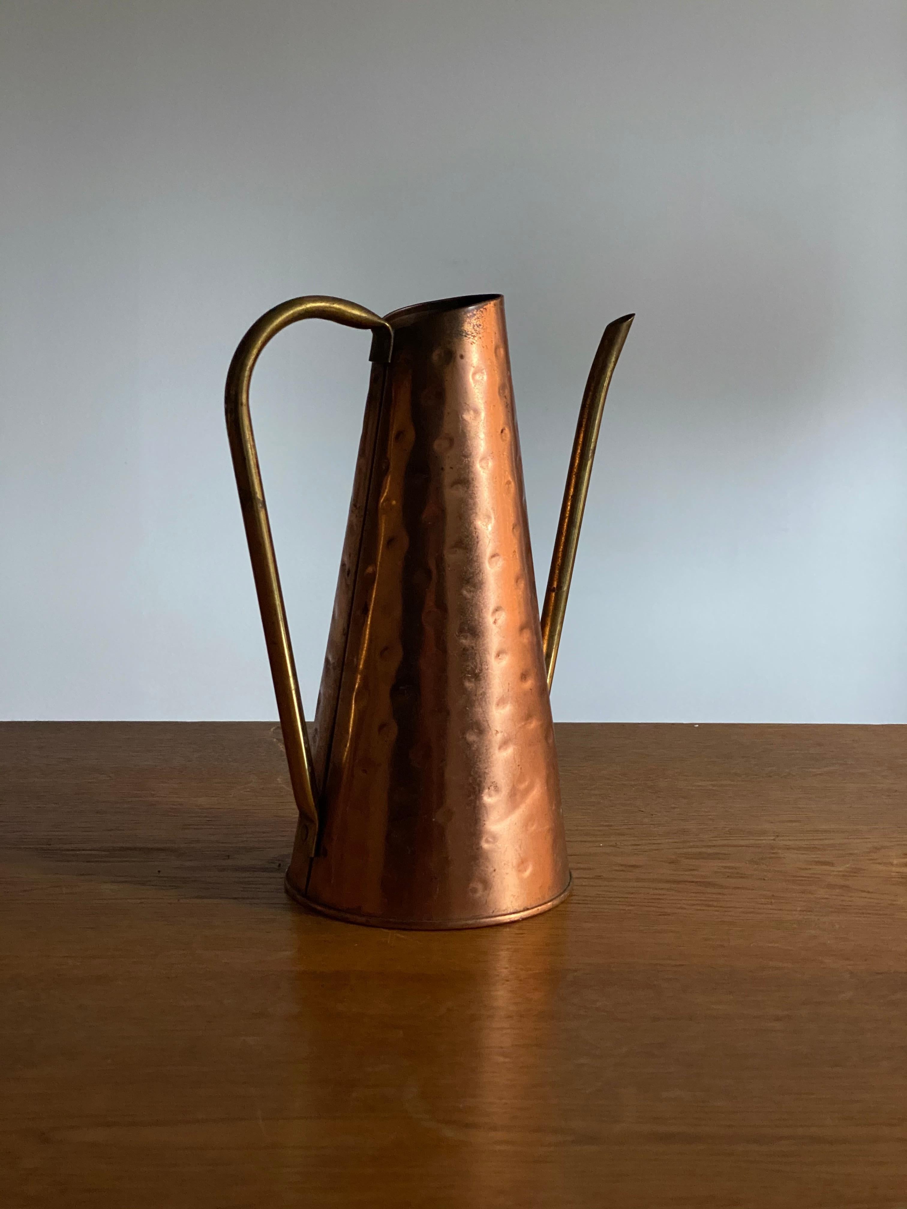 A modernist watering can or pitcher. With lively original patina from use. 

In hammered copper and bent brass pipe, features fine organic forms.