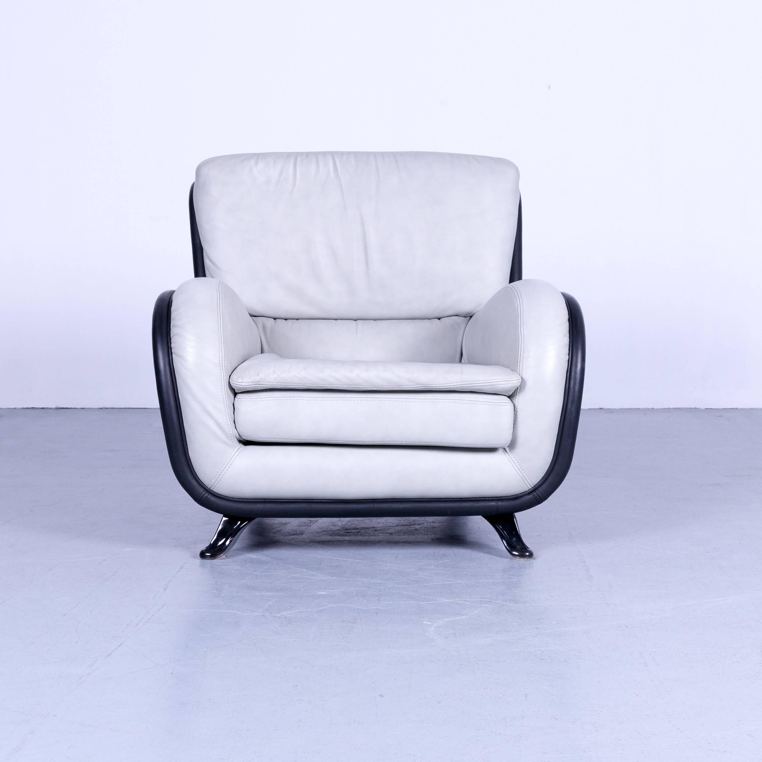 Nieri designer armchair made of leather in a minimalistic and modern design.