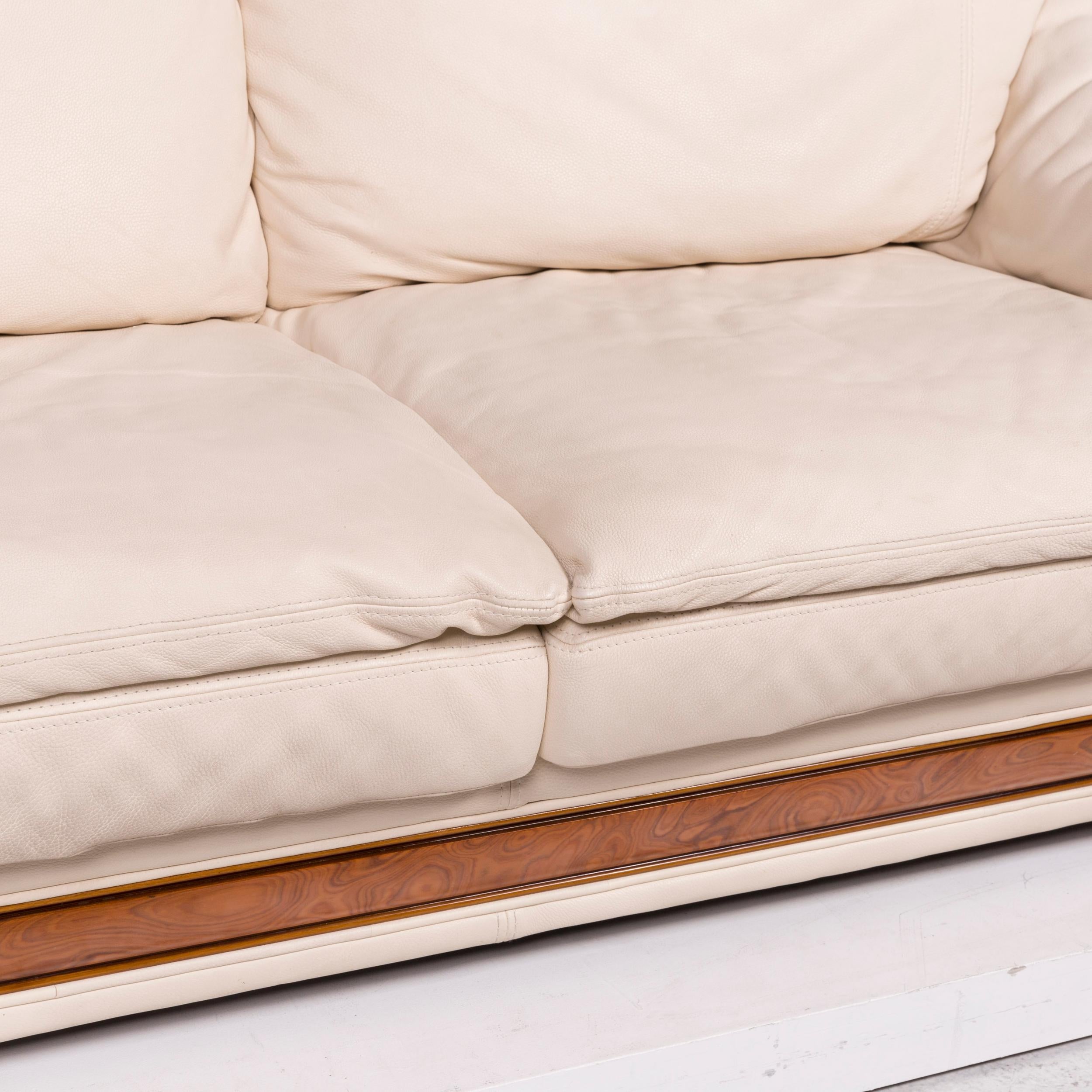 We bring to you a Nieri leather sofa cream two-seat.
  
 

 Product measurements in centimeters:
 

Depth 105
Width 198
Height 85
Seat-height 52
Rest-height 59
Seat-depth 42
Seat-width 134
Back-height 43.