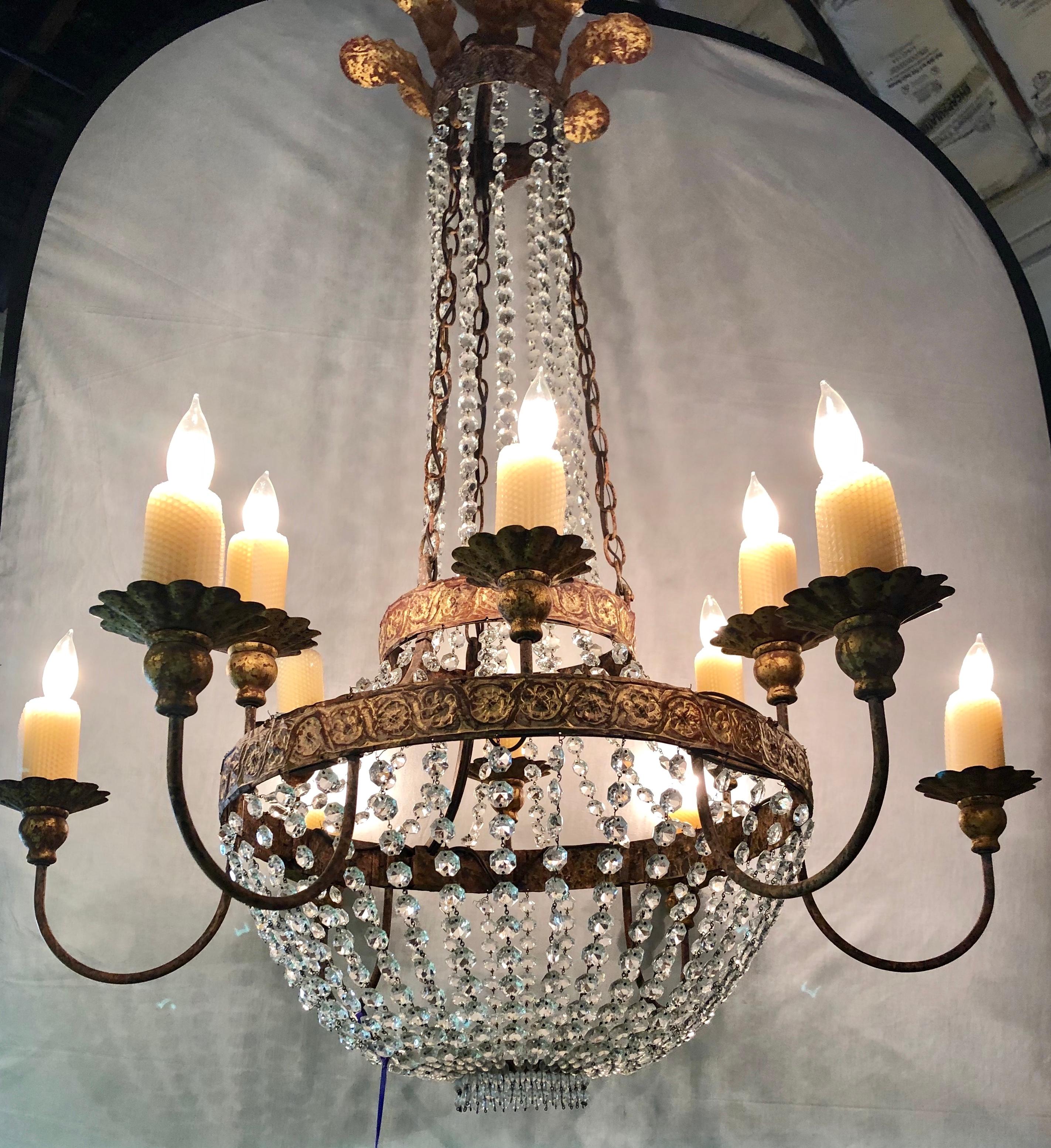 Niermann weeks crystal and bronze campaign chandelier having twelve lights. Fine antique gild and polychrome decorated. As seen priced on the Weeks website, $16,000.