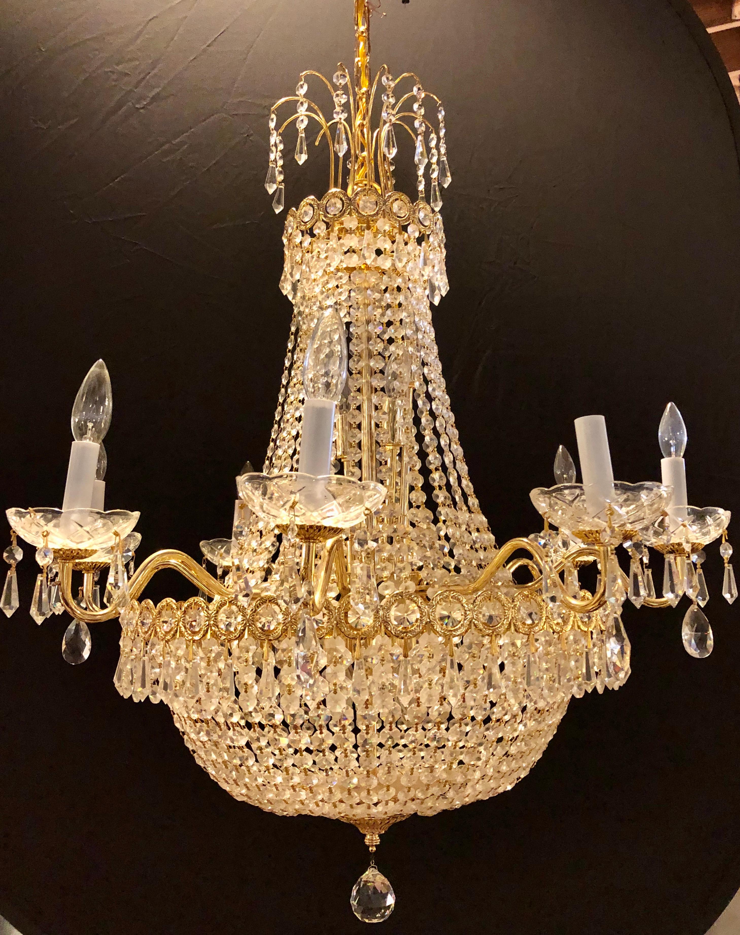 Hollywood Regency style chandelier in the form of Niermann Weeks. Bronze and crystal draping basket form crystal. 
Here you can celebrate the beauty of 18th century northern European lighting design with this lovely weeks style Belvedere looking